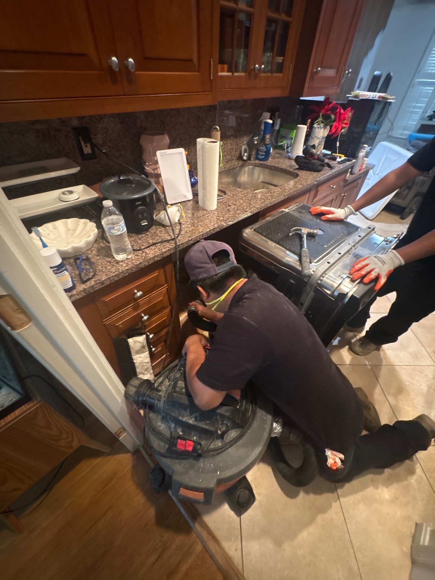 Water damage restoration in Alexandria: wet structural materials and drying equipment positioned for moisture removal.
