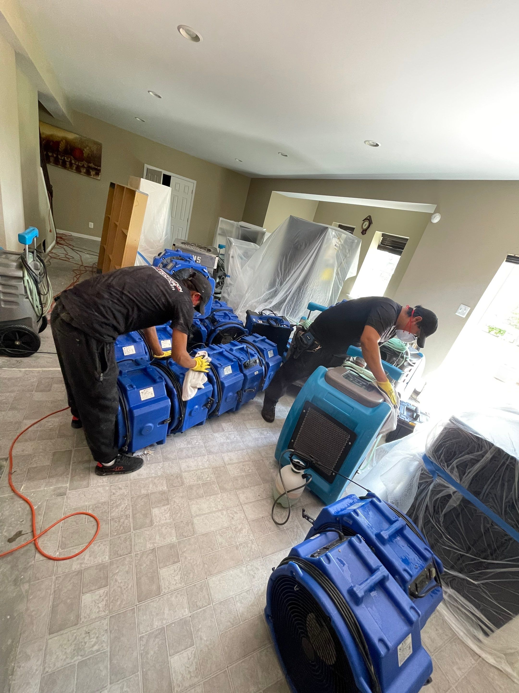 Final stage of water restoration in Oakton showing cleared flooring and completed drying remediation.