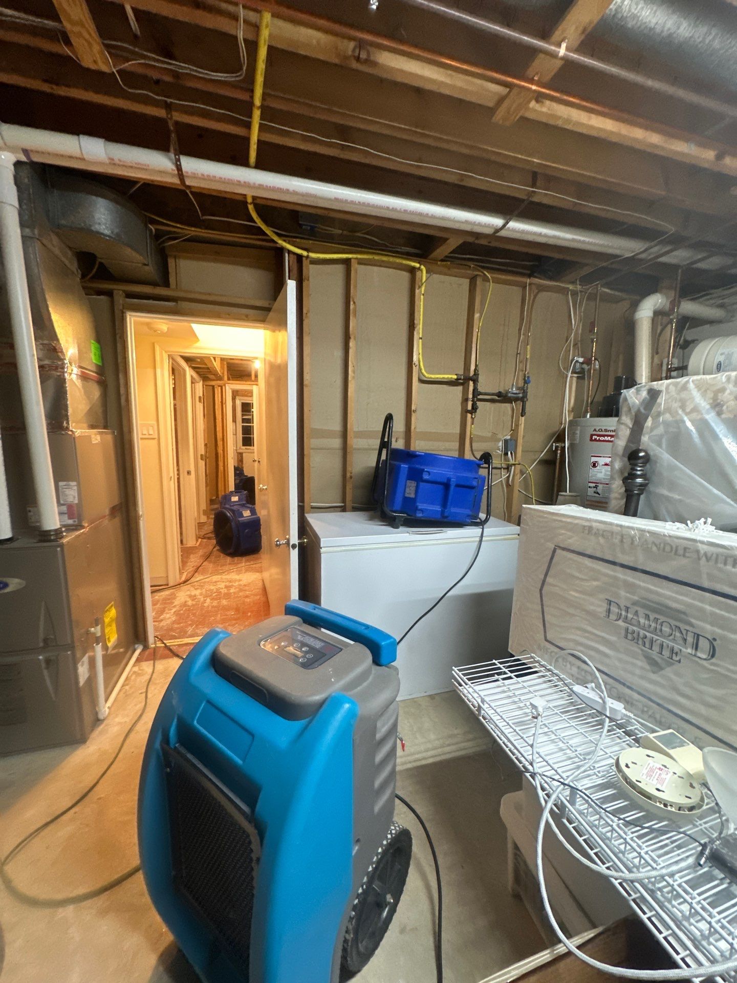 Affected ceiling material removal and preparation for replacement during remediation.