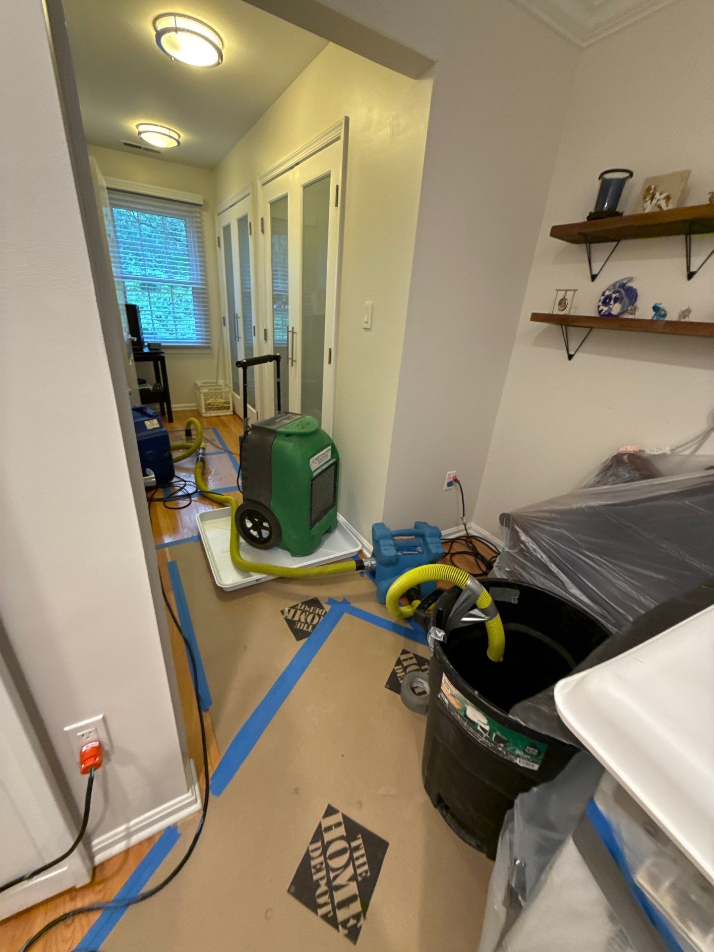 Drying phase progressing with equipment monitoring moisture levels in Arlington water damage job.