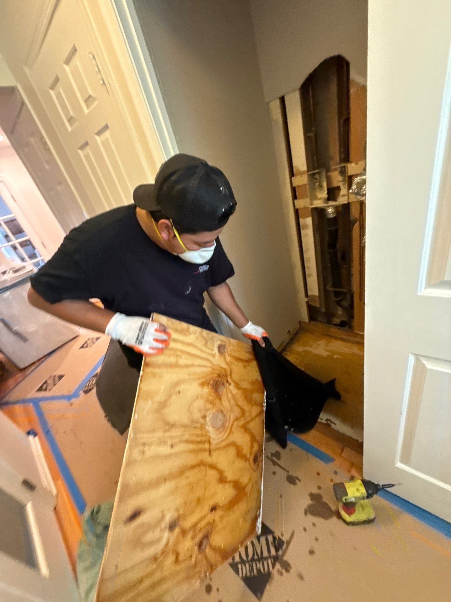 Damaged wall sections documented before removal during Arlington water restoration process.