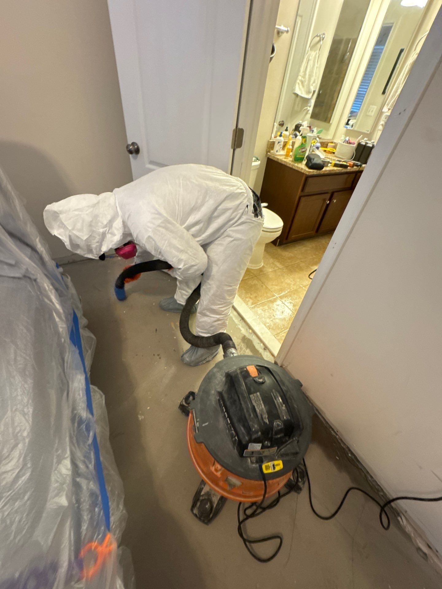 Drying equipment monitoring moisture levels in wall cavities and structural materials throughout the restoration process.