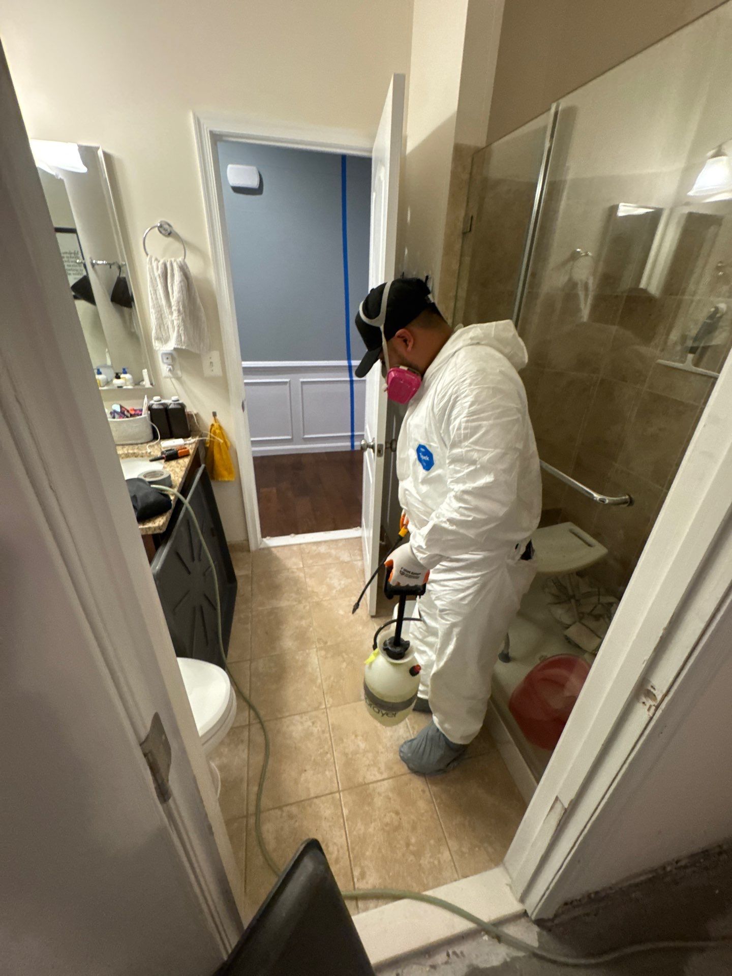 Thermal imaging camera capturing moisture distribution across wall and flooring during water damage restoration in Aldie.