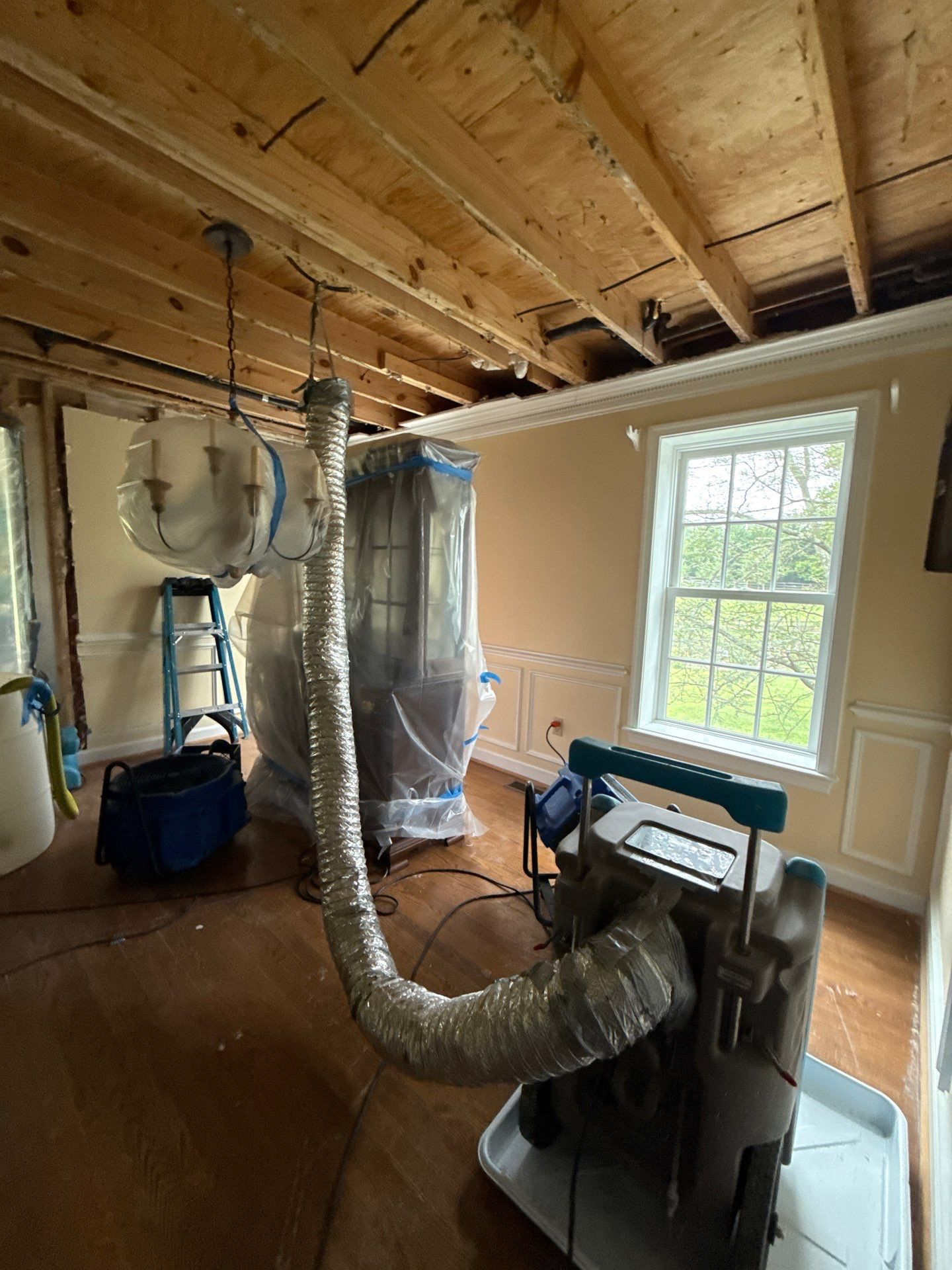 Final stages of dehumidification, preparing space for containment removal.