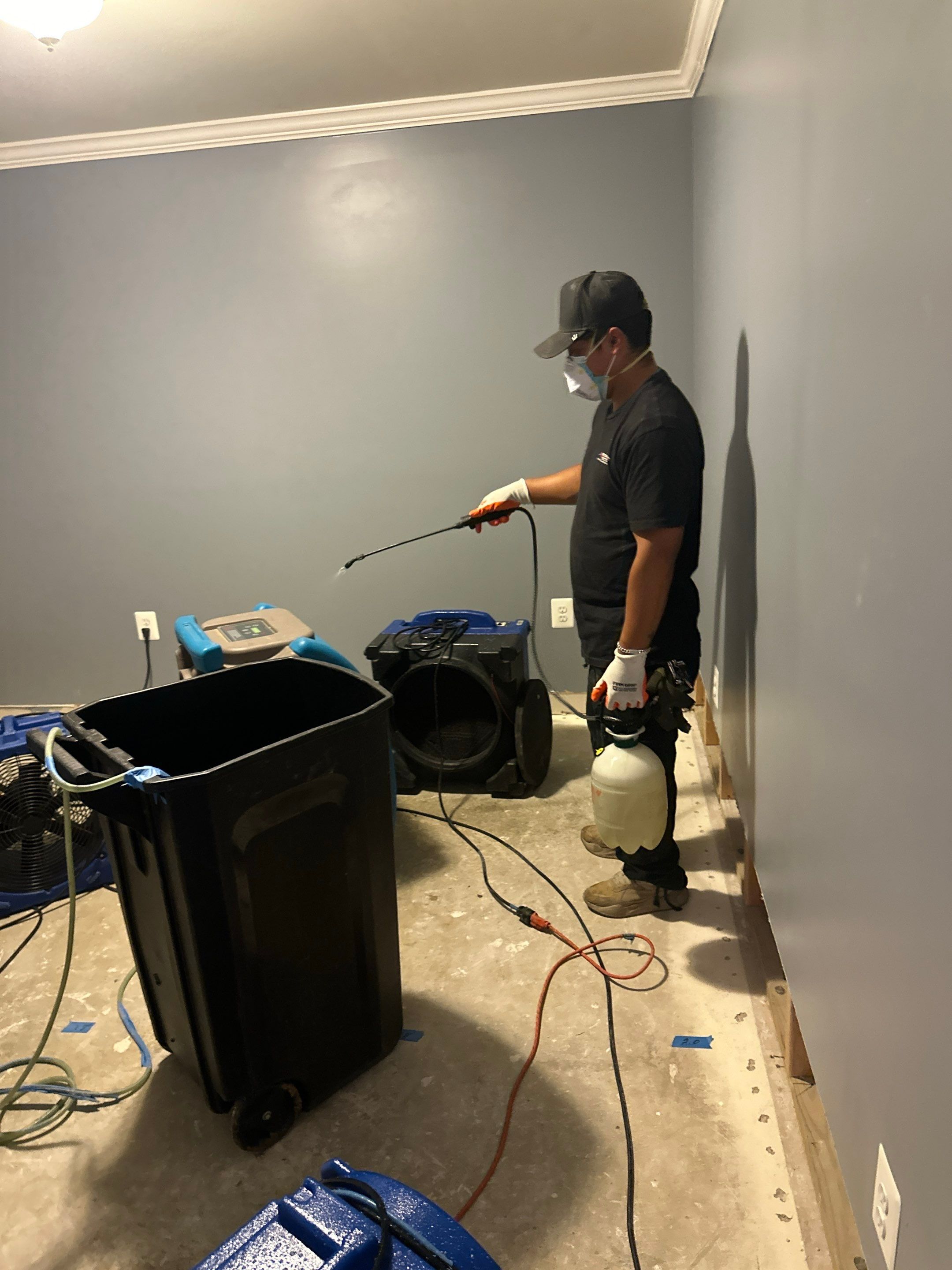 Continued dehumidification and air circulation during mid-stage structural drying phase.