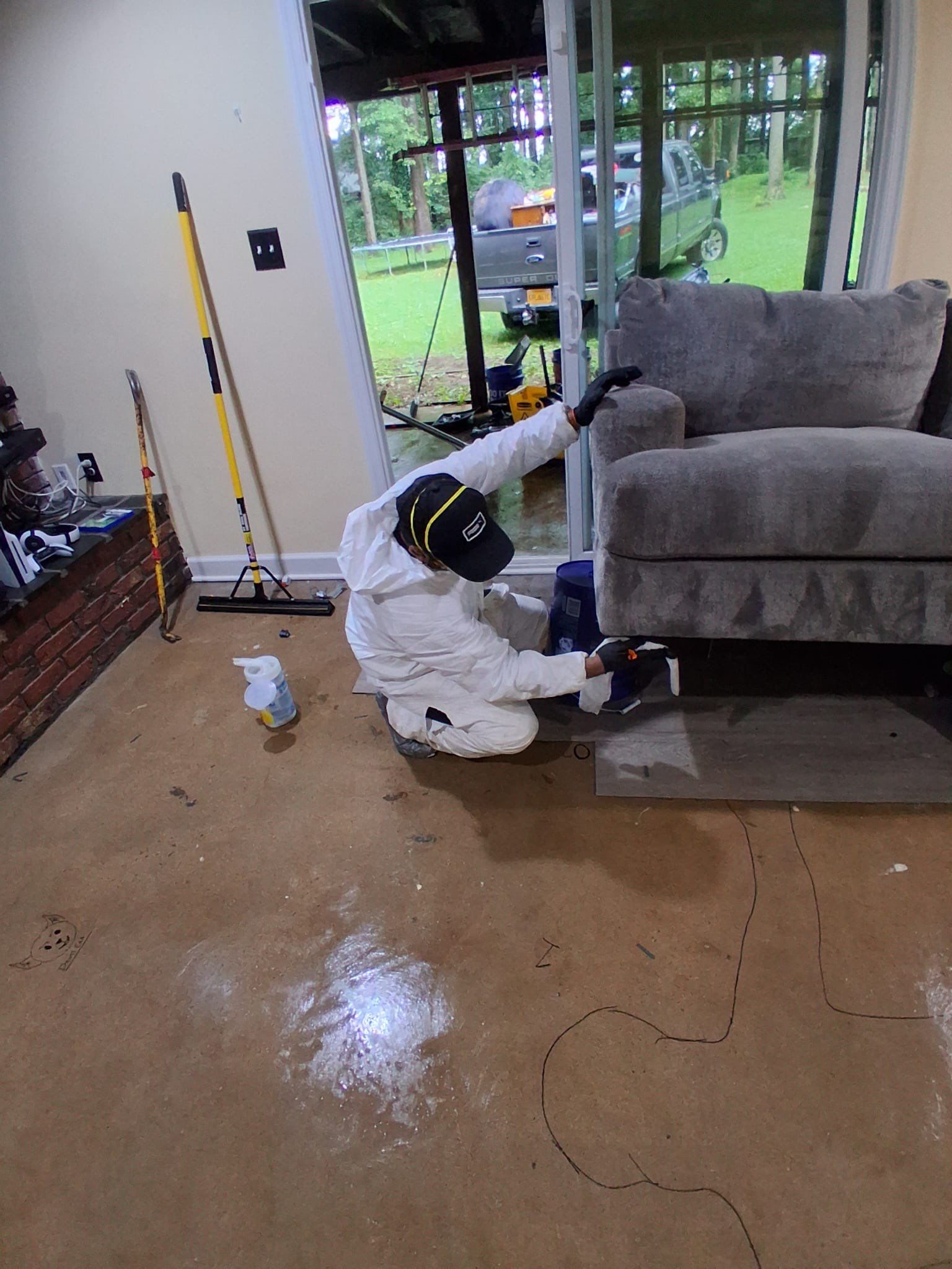 Structural drying in progress with dehumidification and air movement equipment positioned throughout the water-damaged area.