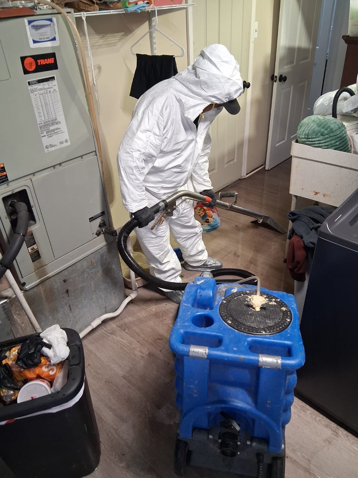 Standing water extraction underway in Warrenton water damage restoration, removing pooled water from affected interior space.