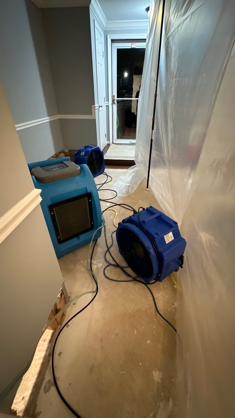 Completed water damage restoration in Manassas showing dried flooring and cleared equipment after remediation.