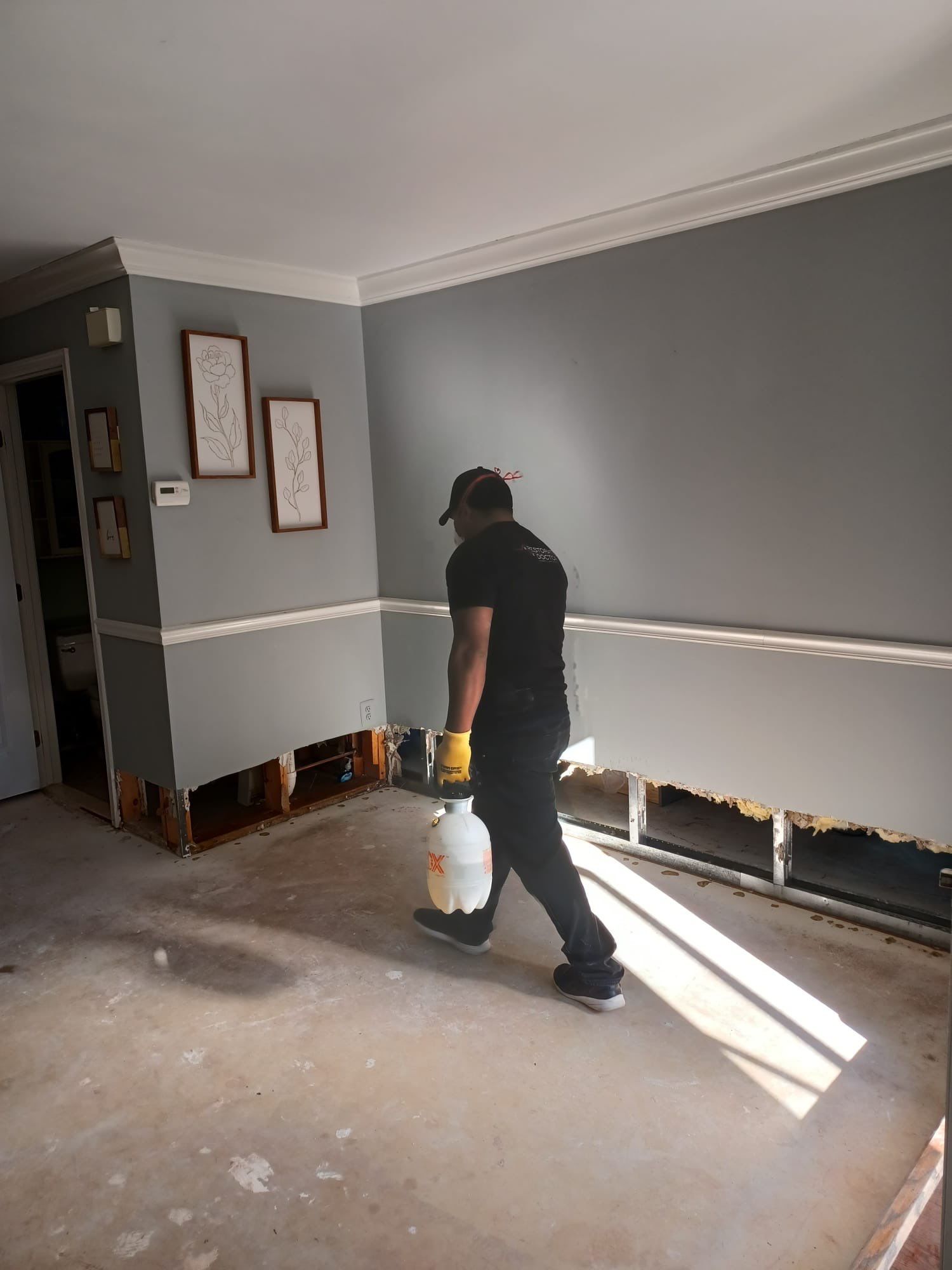 Late-stage drying with dehumidifiers and extraction equipment removing residual moisture from flooring substrate.
