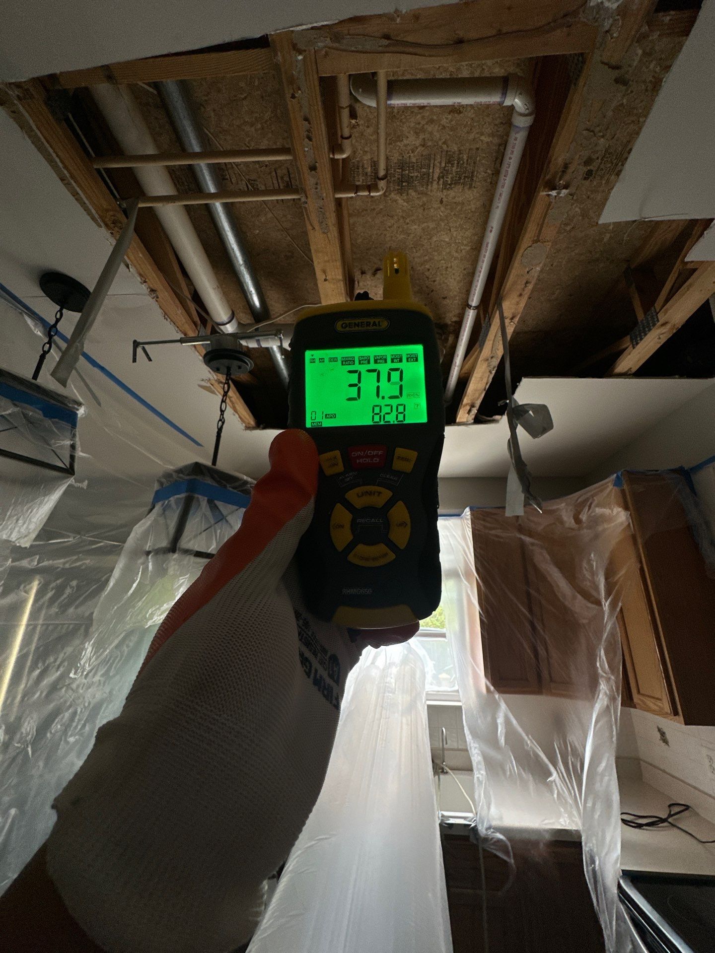 Ceiling repair preparation underway as structural drying continues through the mold remediation process.
