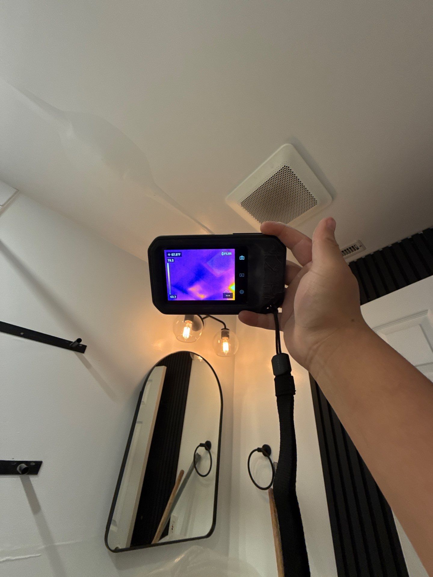 Structural drying phase with dehumidifiers and air movers positioned throughout affected room during Manassas water restoration.