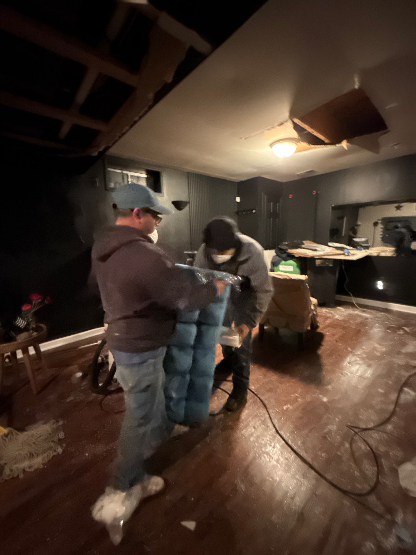 Damaged wall sections marked for replacement during Manassas water damage restoration structural rebuild phase.