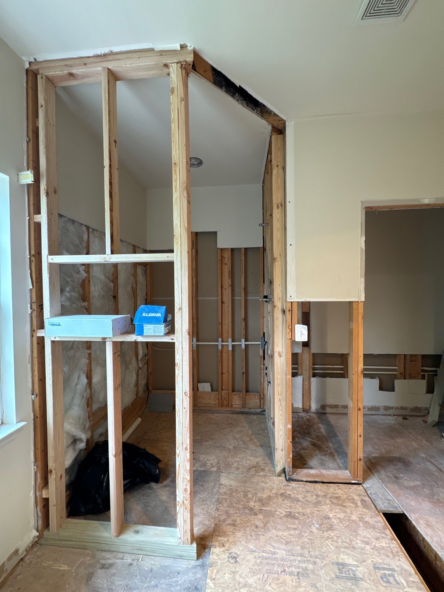 Drying equipment monitoring moisture levels in wall cavities and floor assembly.