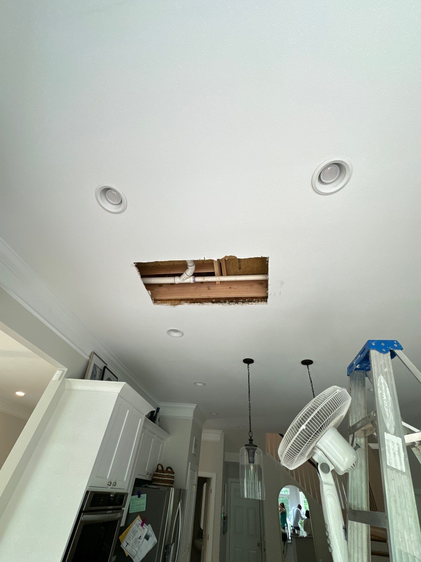 Restored flooring and dried structural components following water damage restoration completion.