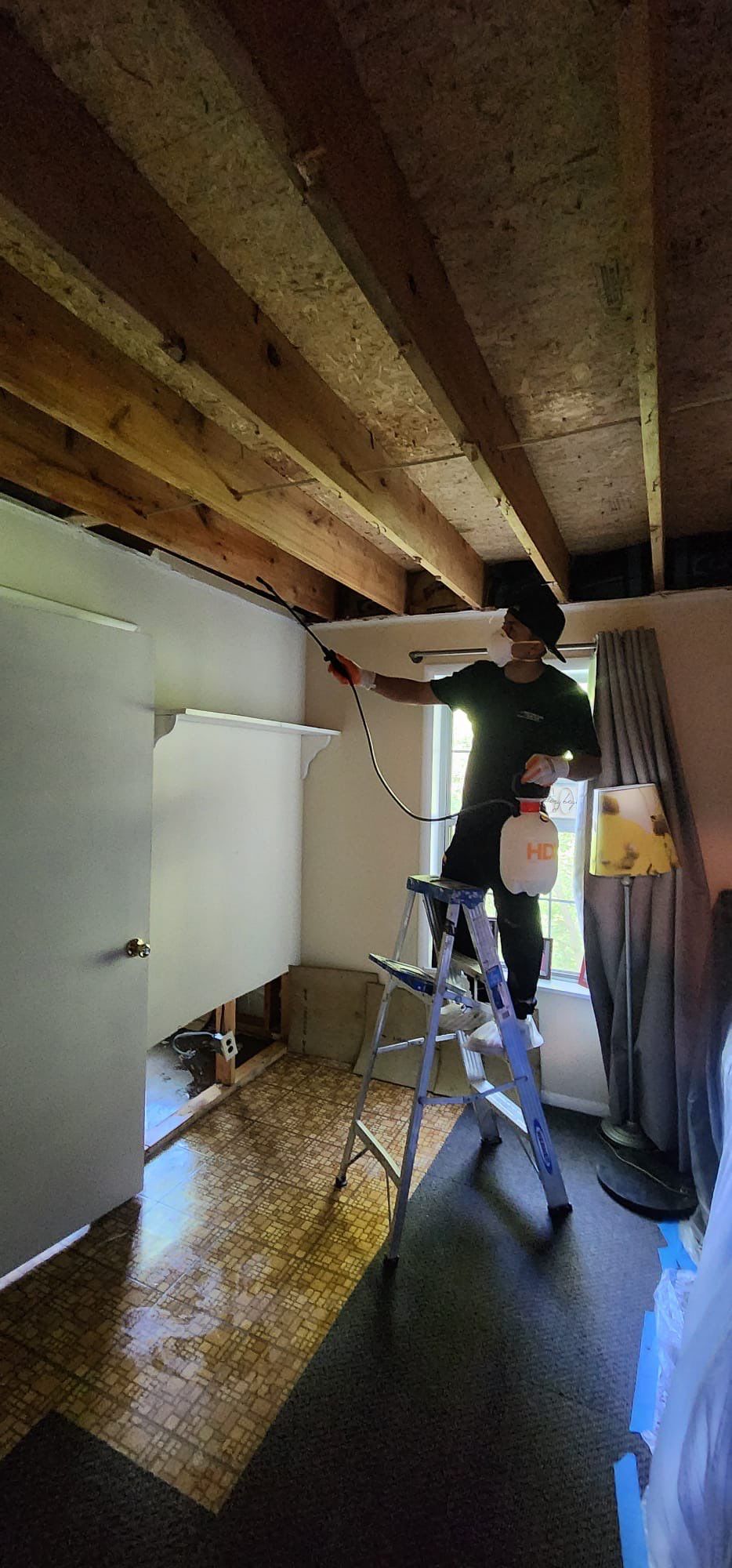 Structural drying in progress with continued dehumidification equipment monitoring moisture levels.