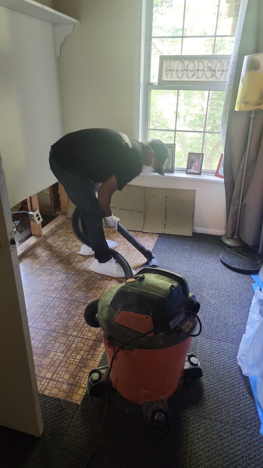 Carpet removal and subfloor exposure as part of water damage remediation in Montclair.