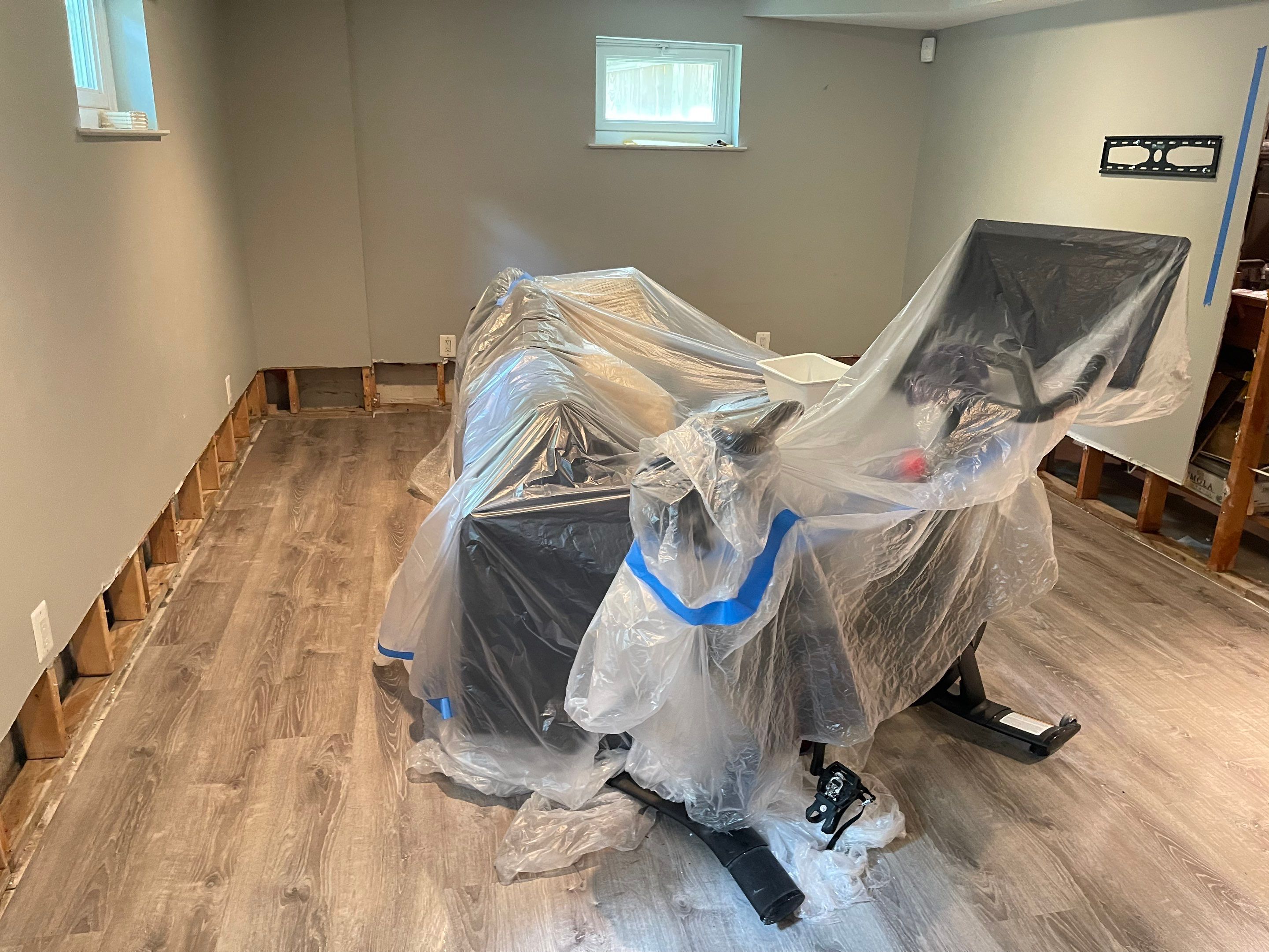 Final-stage inspection confirming moisture levels normalized after Arlington water damage restoration complete.