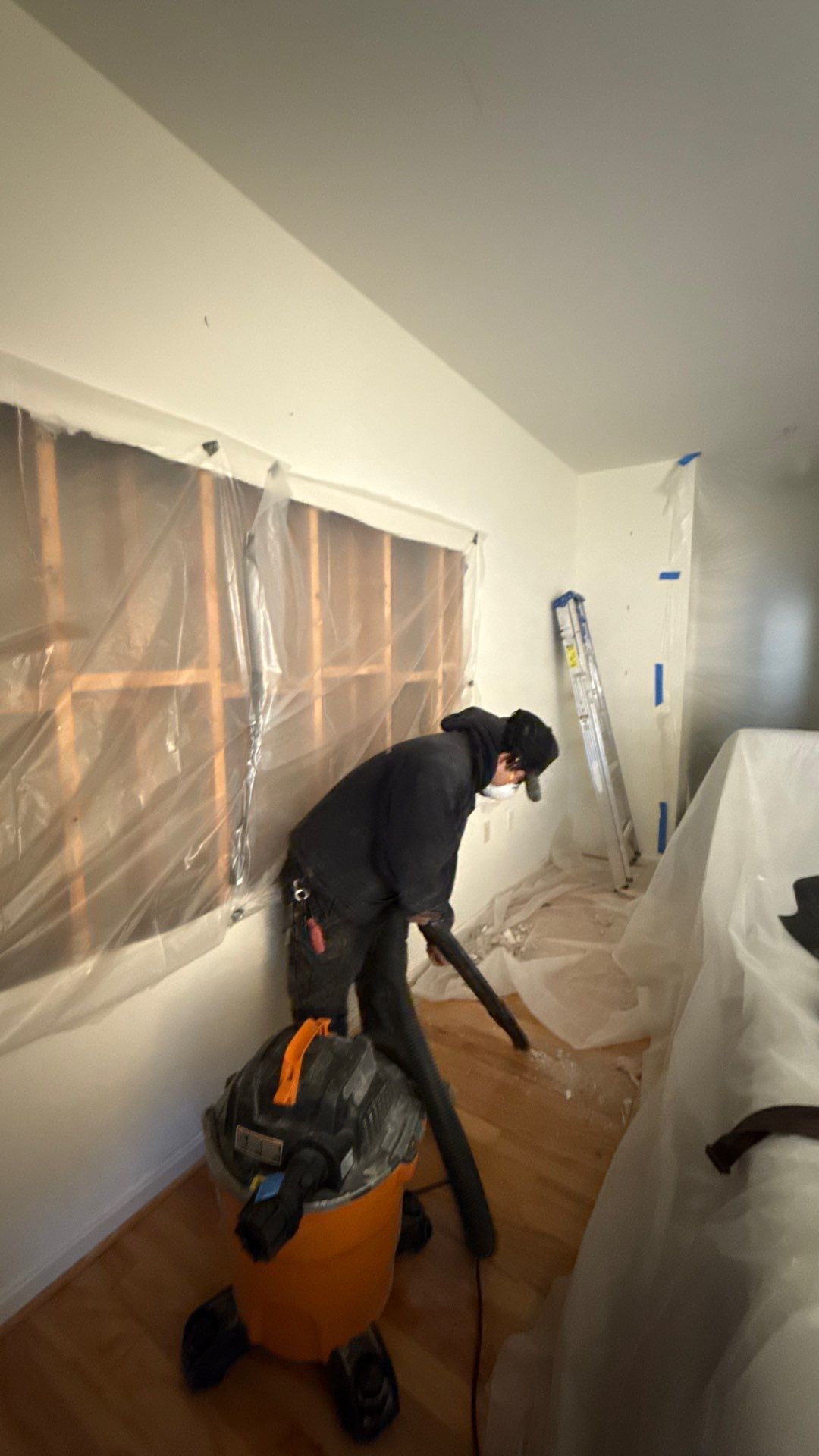 Dehumidifiers and air movers positioned for structural drying phase of water damage restoration.
