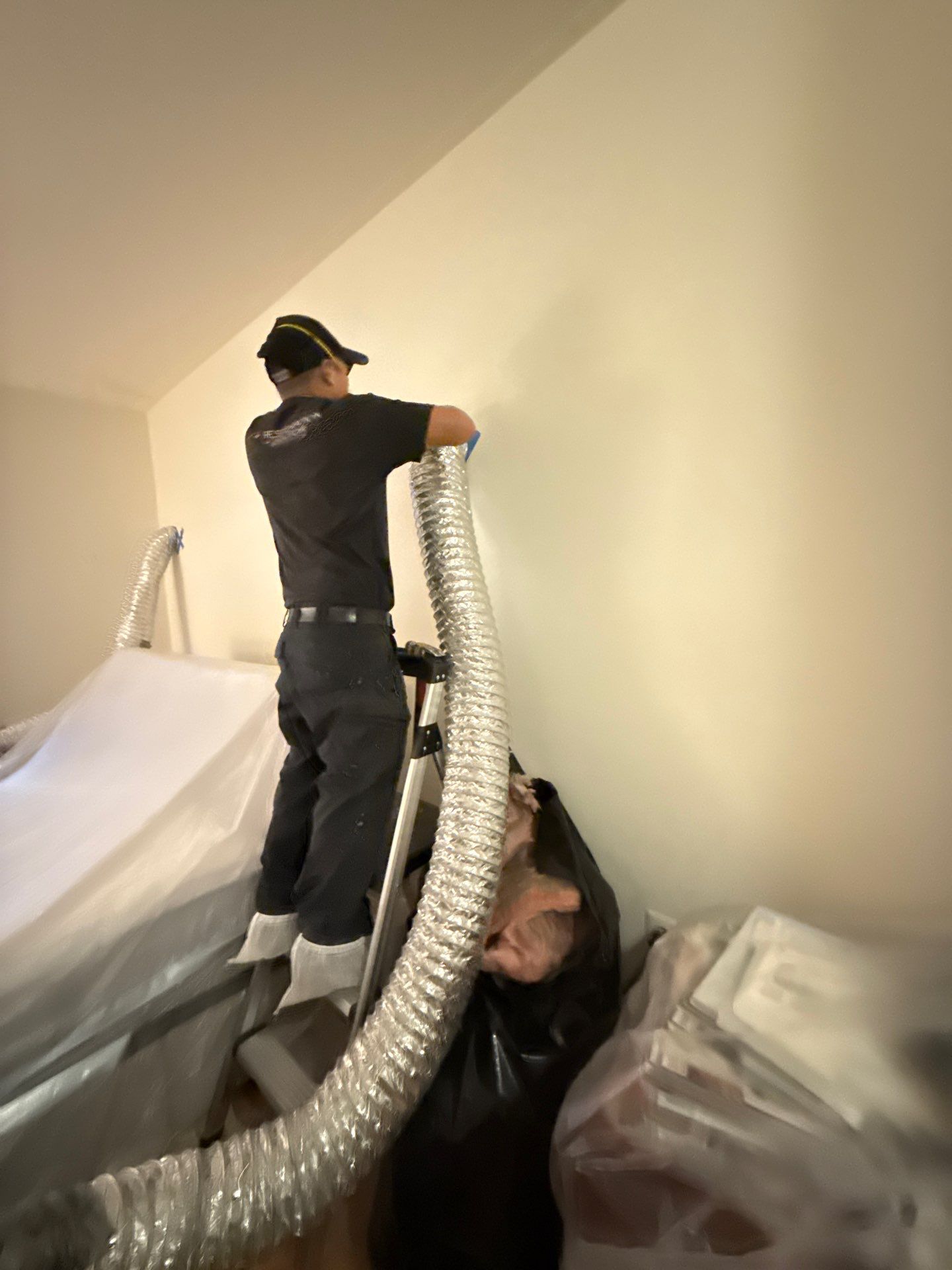 Drying equipment monitoring moisture levels in structural cavities post-extraction.