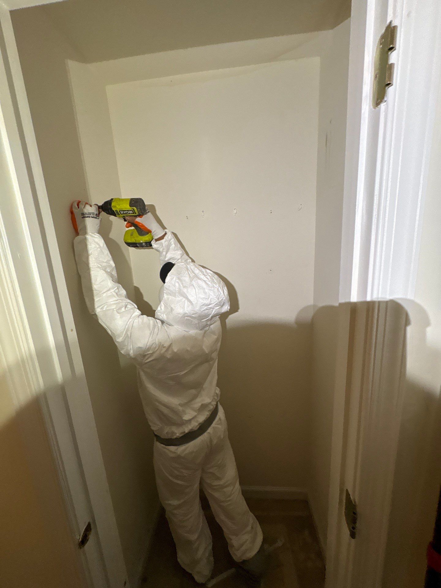 Dehumidifiers and air movers positioned to dry affected framing and prepare ceiling cavity for repair work.