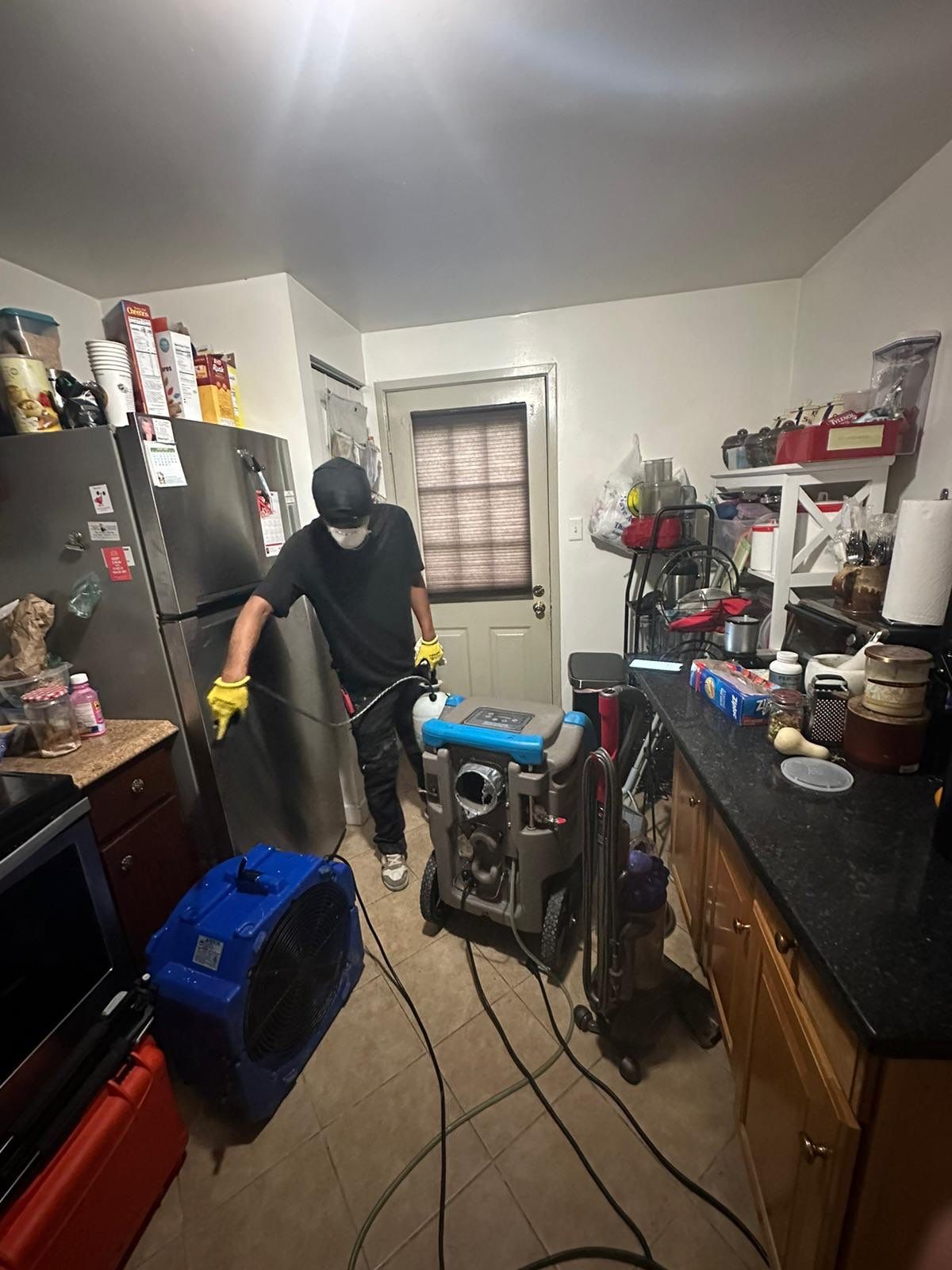 Dehumidification equipment positioned for structural drying during moisture remediation.