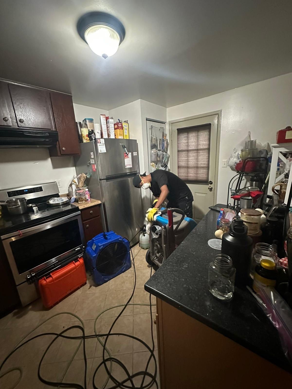 Drying equipment operating during mid-stage water damage restoration work.