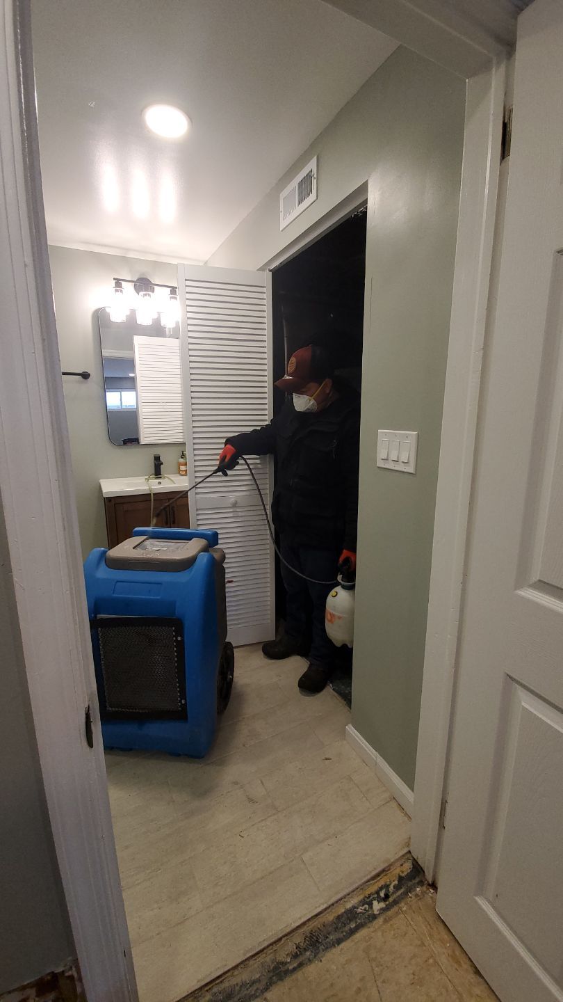Dehumidification equipment positioned for structural drying phase of water damage restoration.