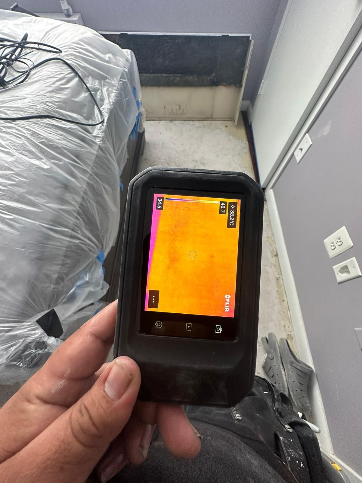 Mid-stage moisture mapping showing thermal variance as extraction and dehumidification reduce water saturation in materials.