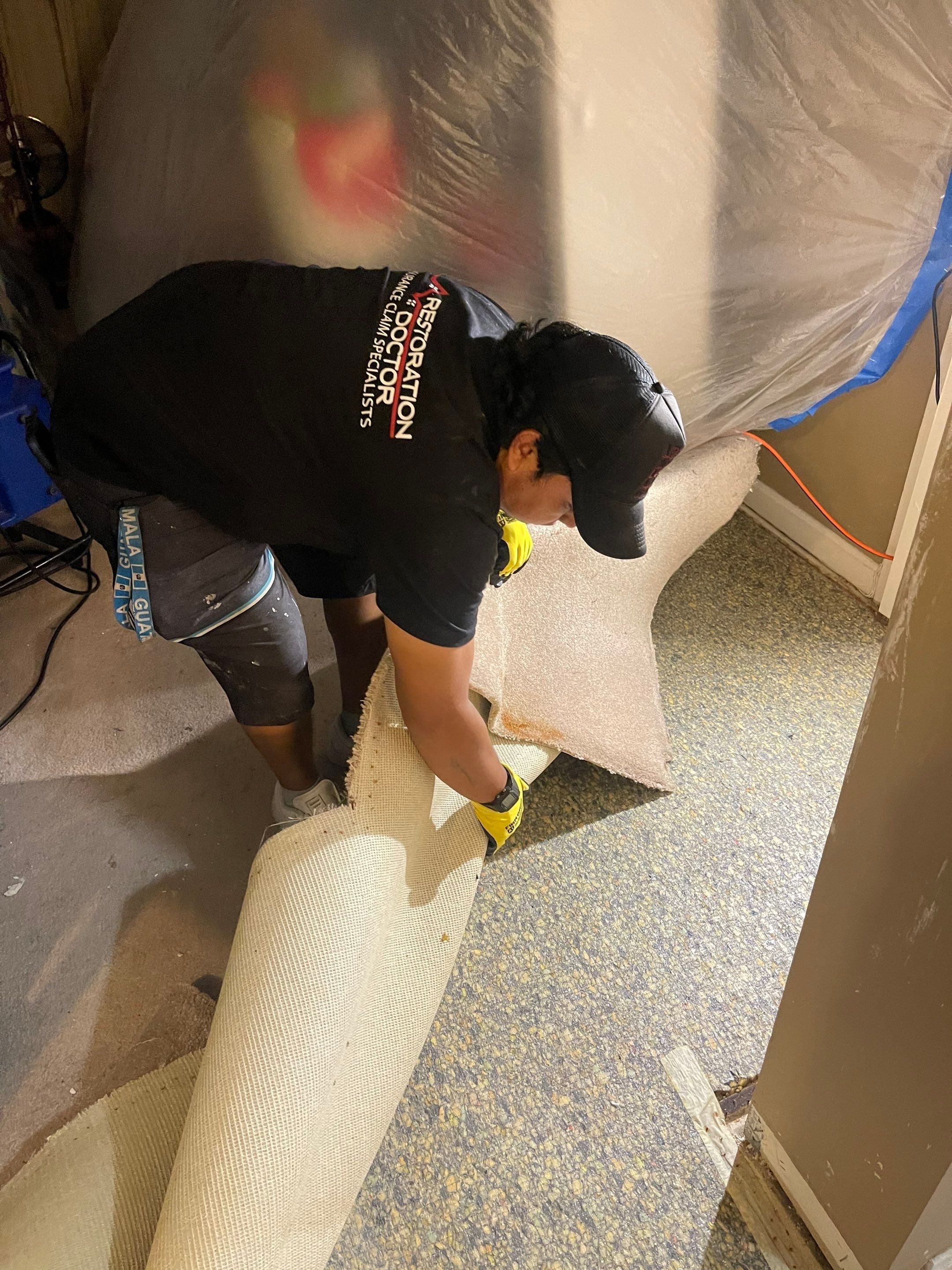 Structural drying in progress with containment and dehumidifiers managing moisture removal.