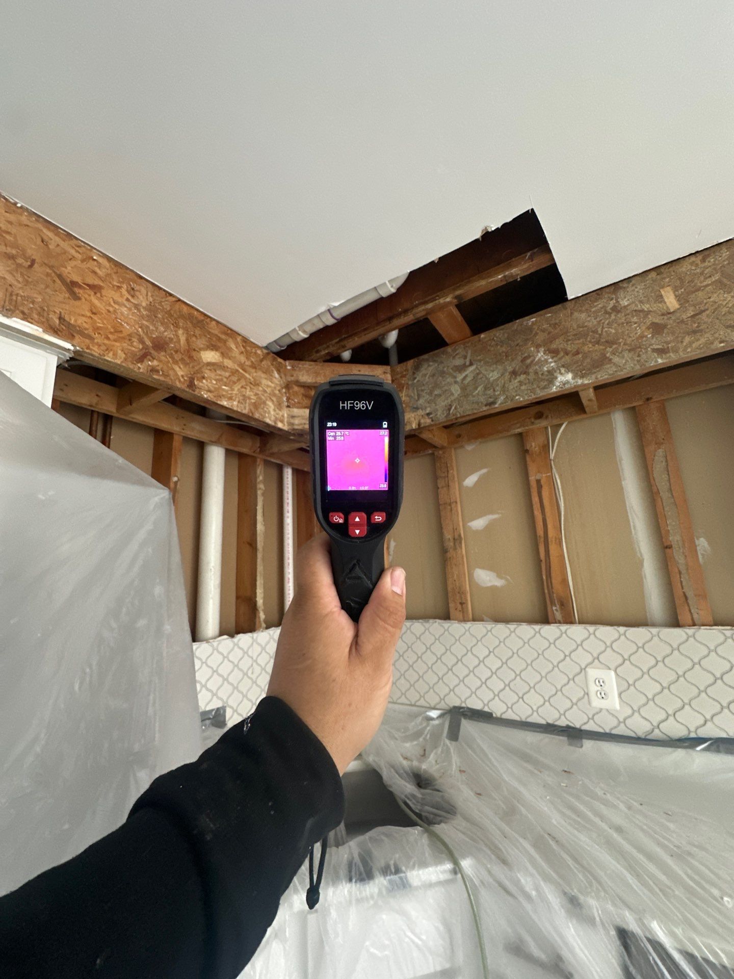 Thermal camera documenting moisture distribution across affected structural surfaces during containment phase.