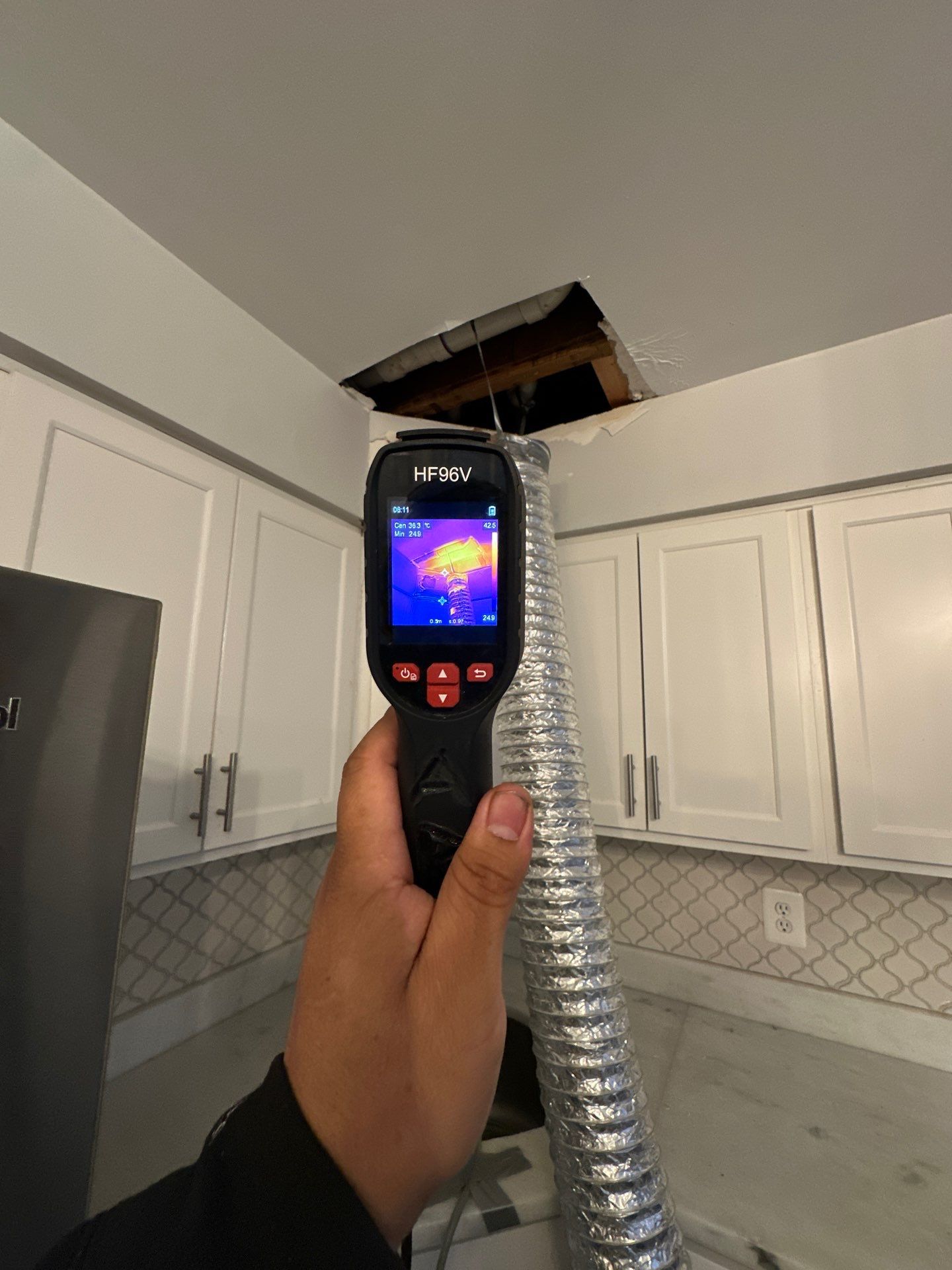 Moisture mapping in progress, showing thermal readings of drying progress on framed walls.