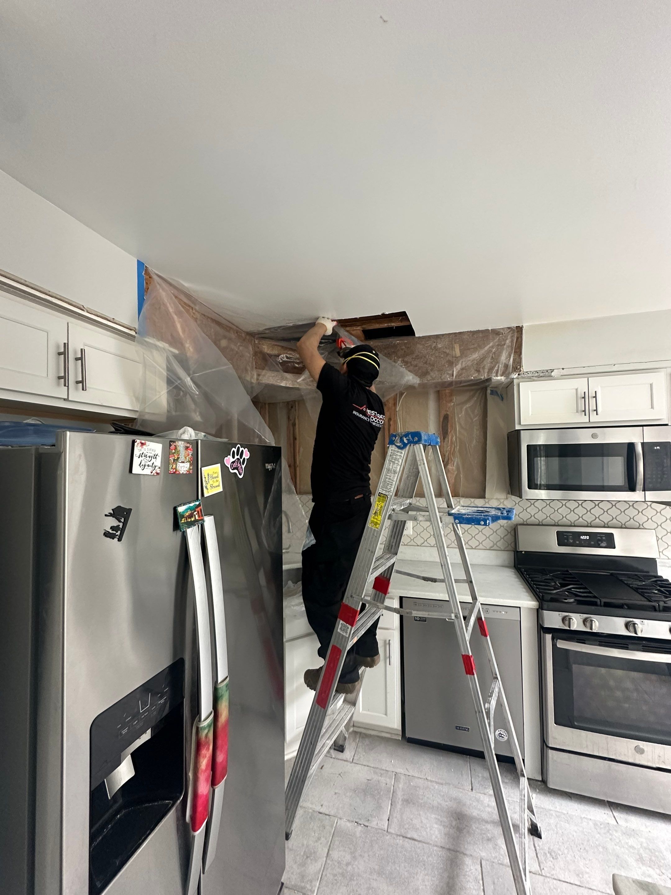 Containment barrier erected during mold remediation in Woodbridge, with thermal imaging equipment positioned for moisture assessment.