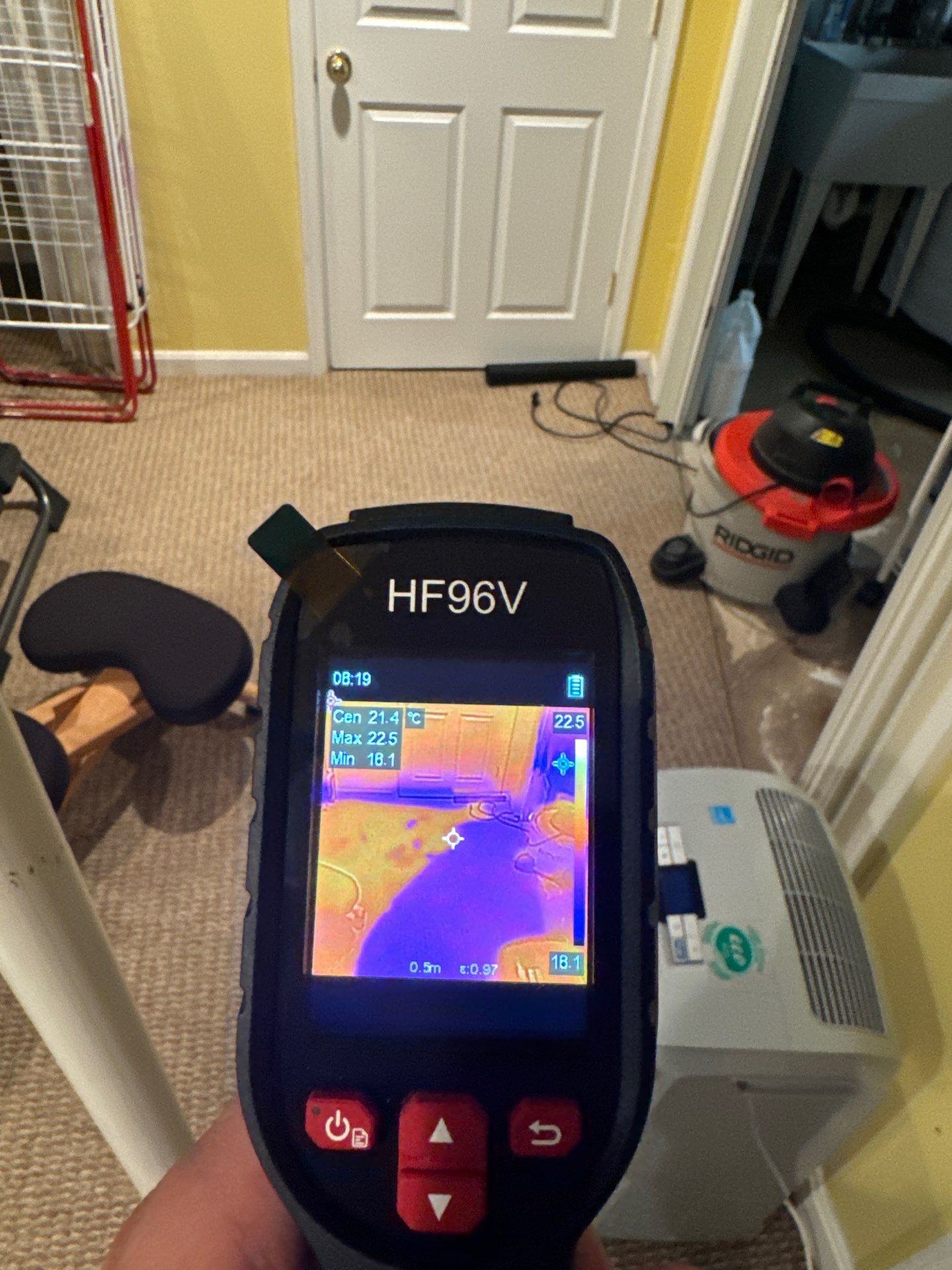 Water damage restoration in Great Falls: initial assessment with drying equipment and protected contents staged for recovery.