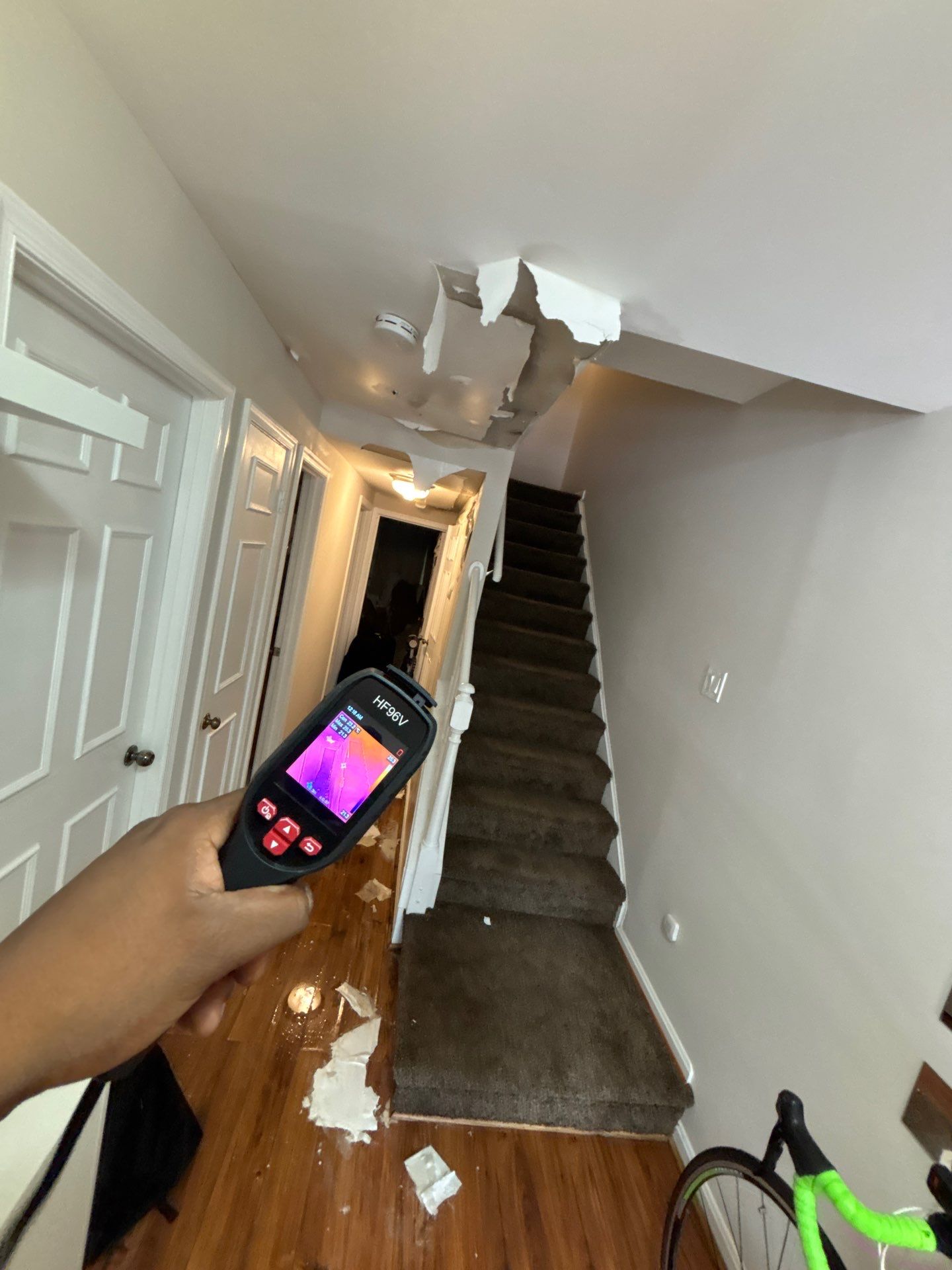 Water-damaged ceiling drywall with discoloration and sagging, Church water damage restoration initial assessment.