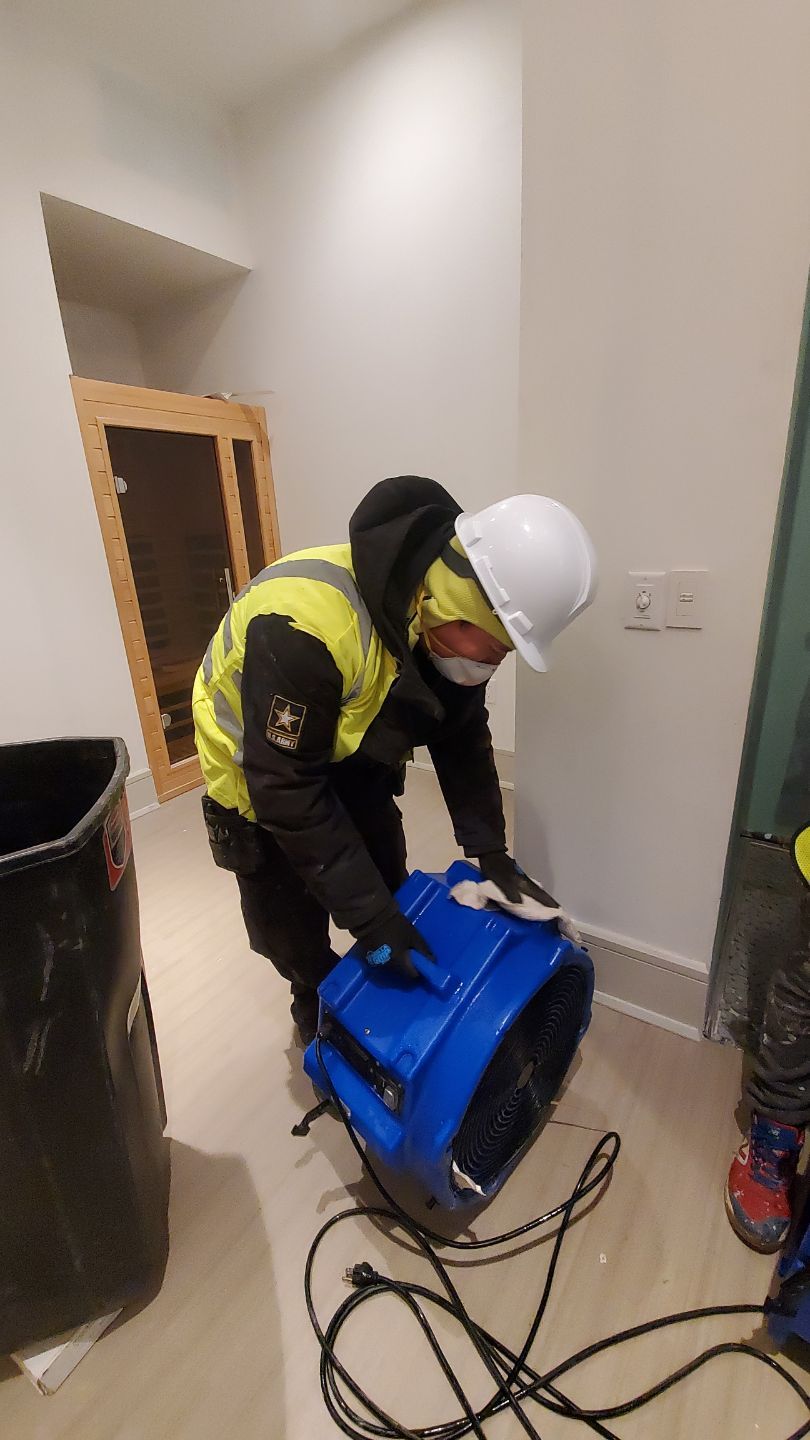 Dehumidification equipment positioned for structural drying phase of water damage restoration.