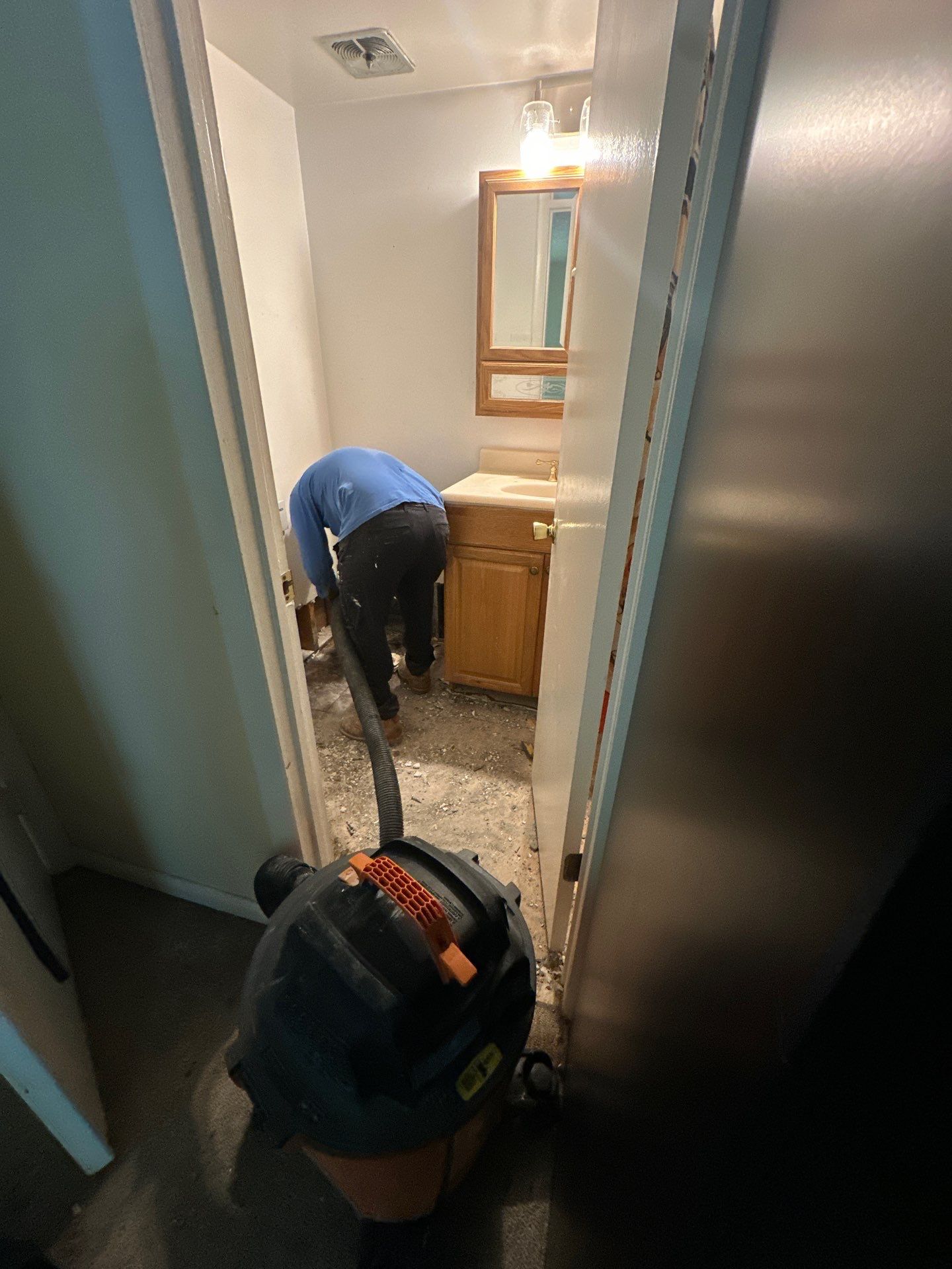 Standing water being extracted from a water-damaged room in Annandale during initial assessment and removal phase.