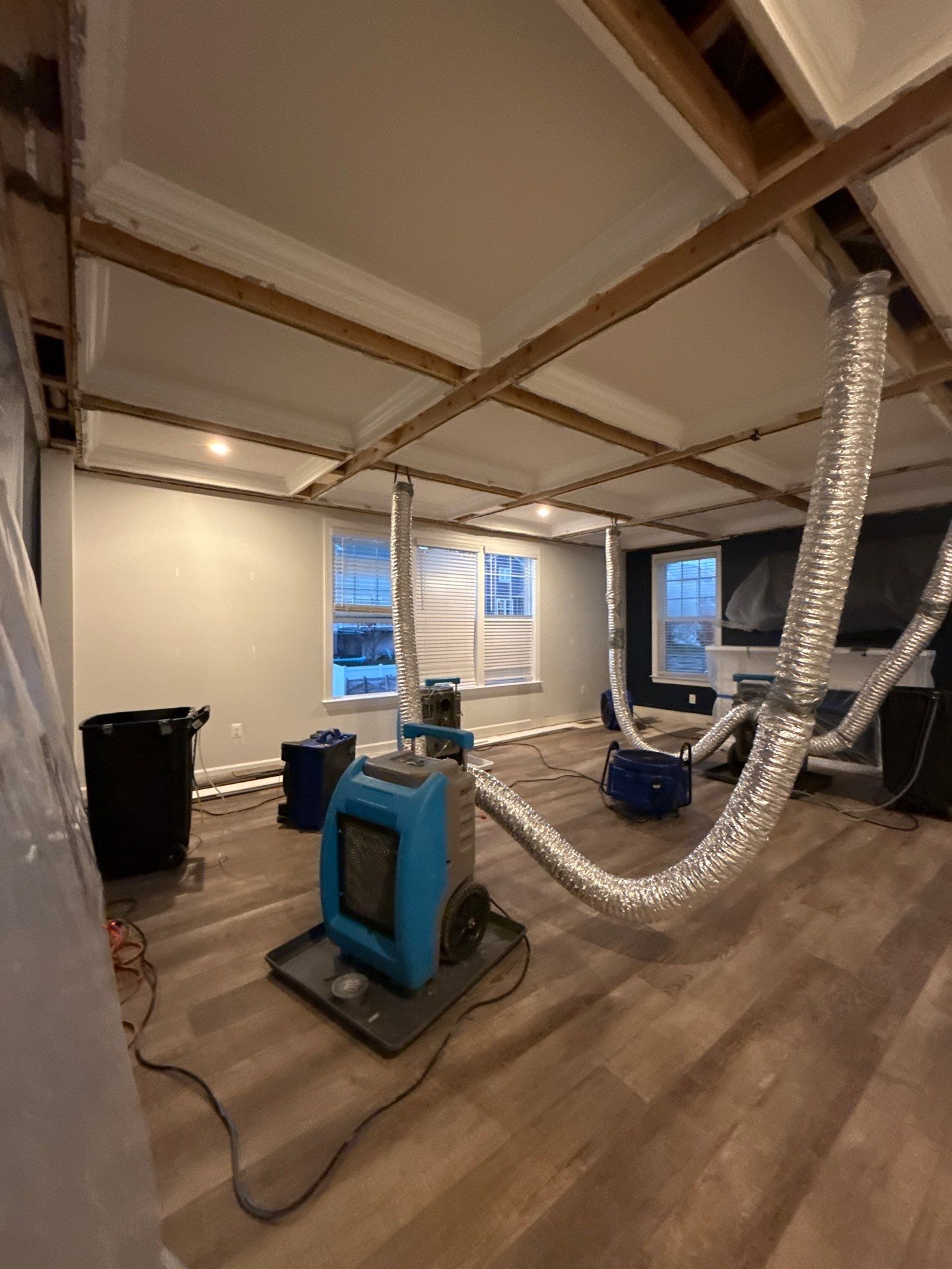 Ceiling damage assessment and preparation for repair work.