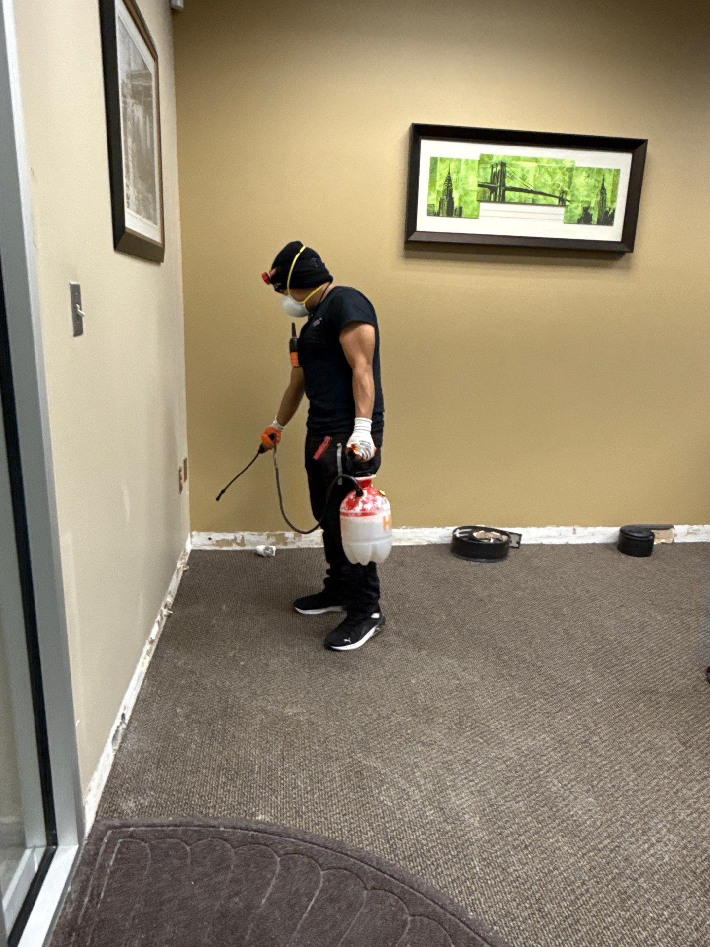 Drying equipment positioned to remove moisture from affected walls and structural framing.