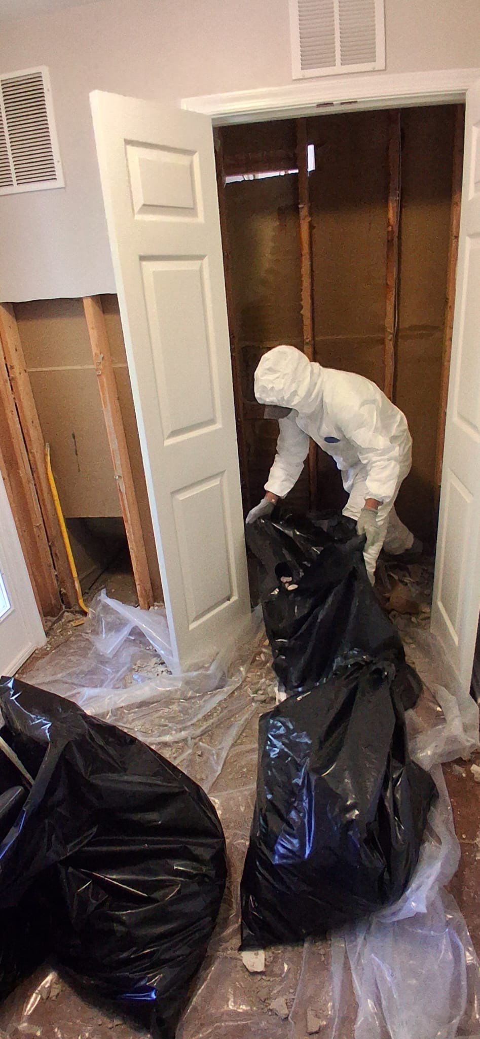 Moisture mapping and inspection of affected materials during mid-stage water damage restoration work.