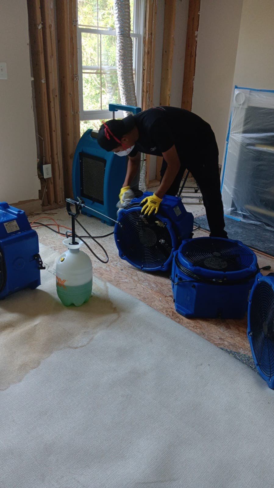 Final-stage water damage restoration in Arlington showing cleared space and completed dehumidification drying cycle.