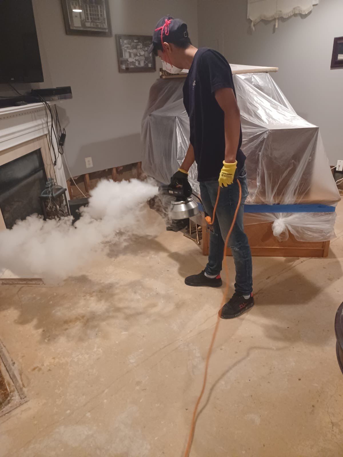 Mid-stage drying with dehumidifiers and extractors deployed across affected area.