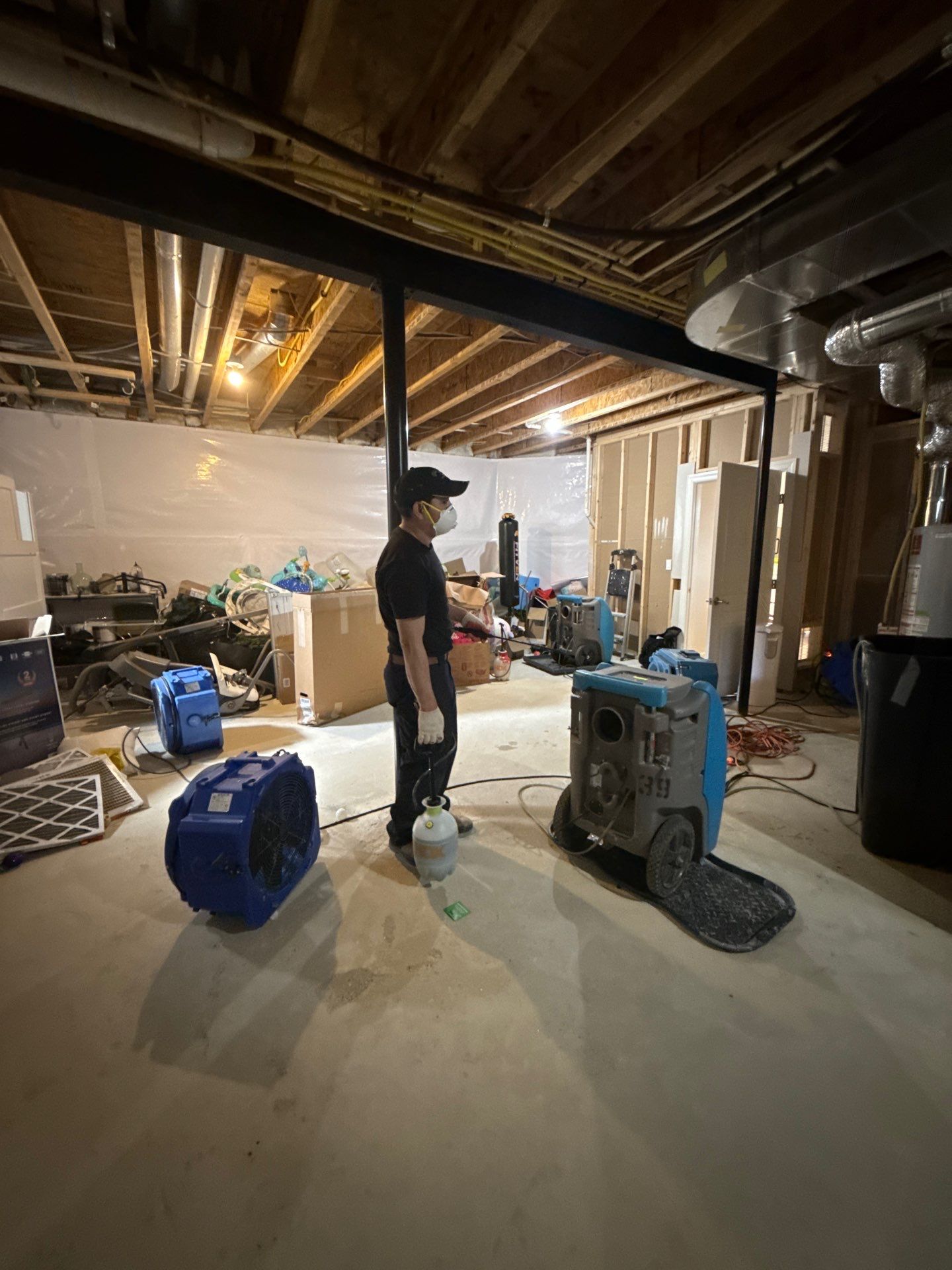 Mid-stage drying with dehumidifiers and extraction equipment in Alexandria remediation.