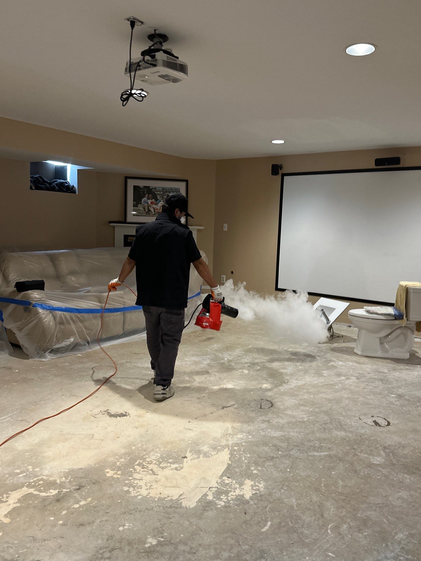 Structural drying in progress with containment barrier isolating affected area.