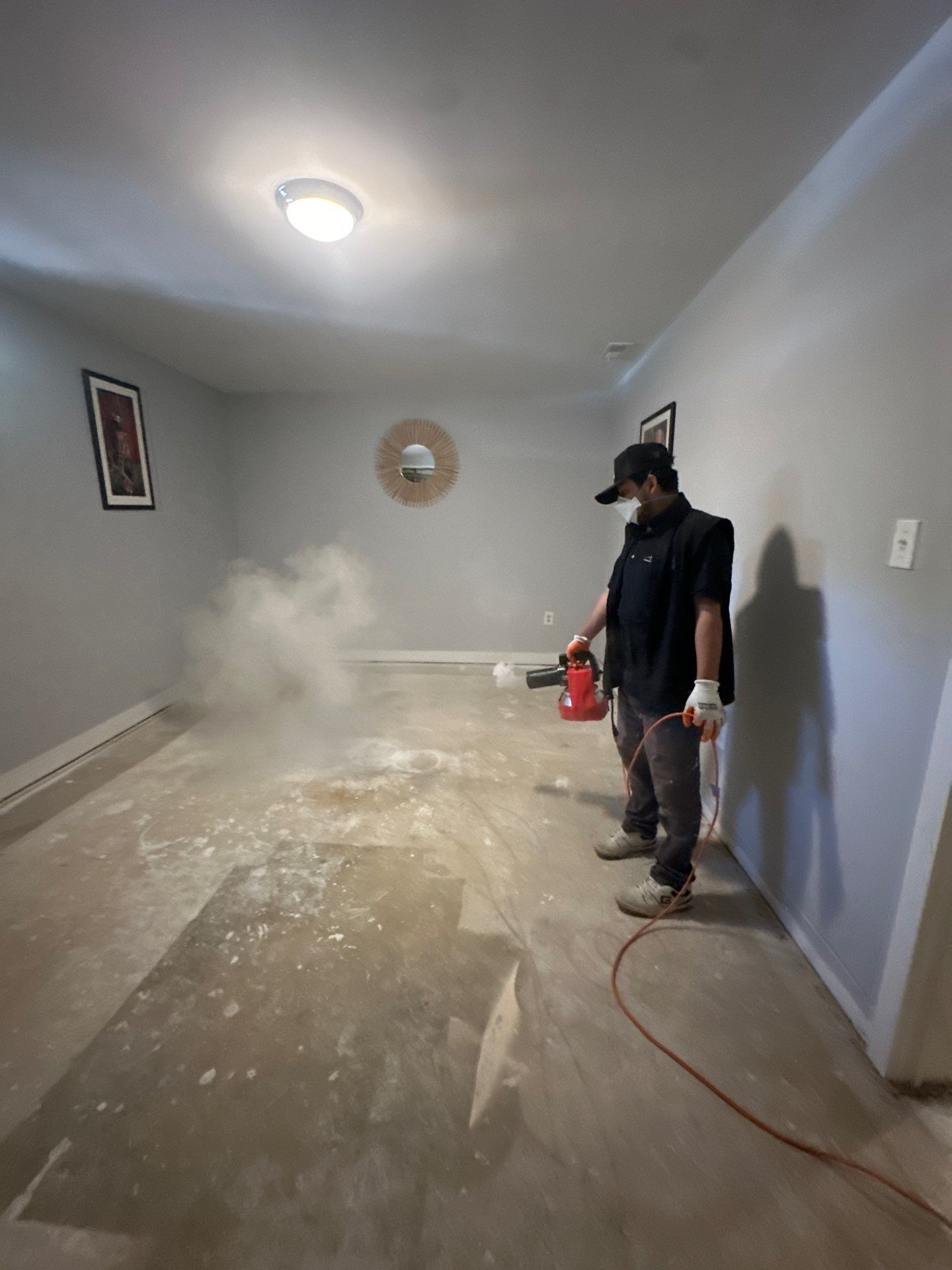 Mid-stage drying showing containment barrier and active moisture removal equipment.