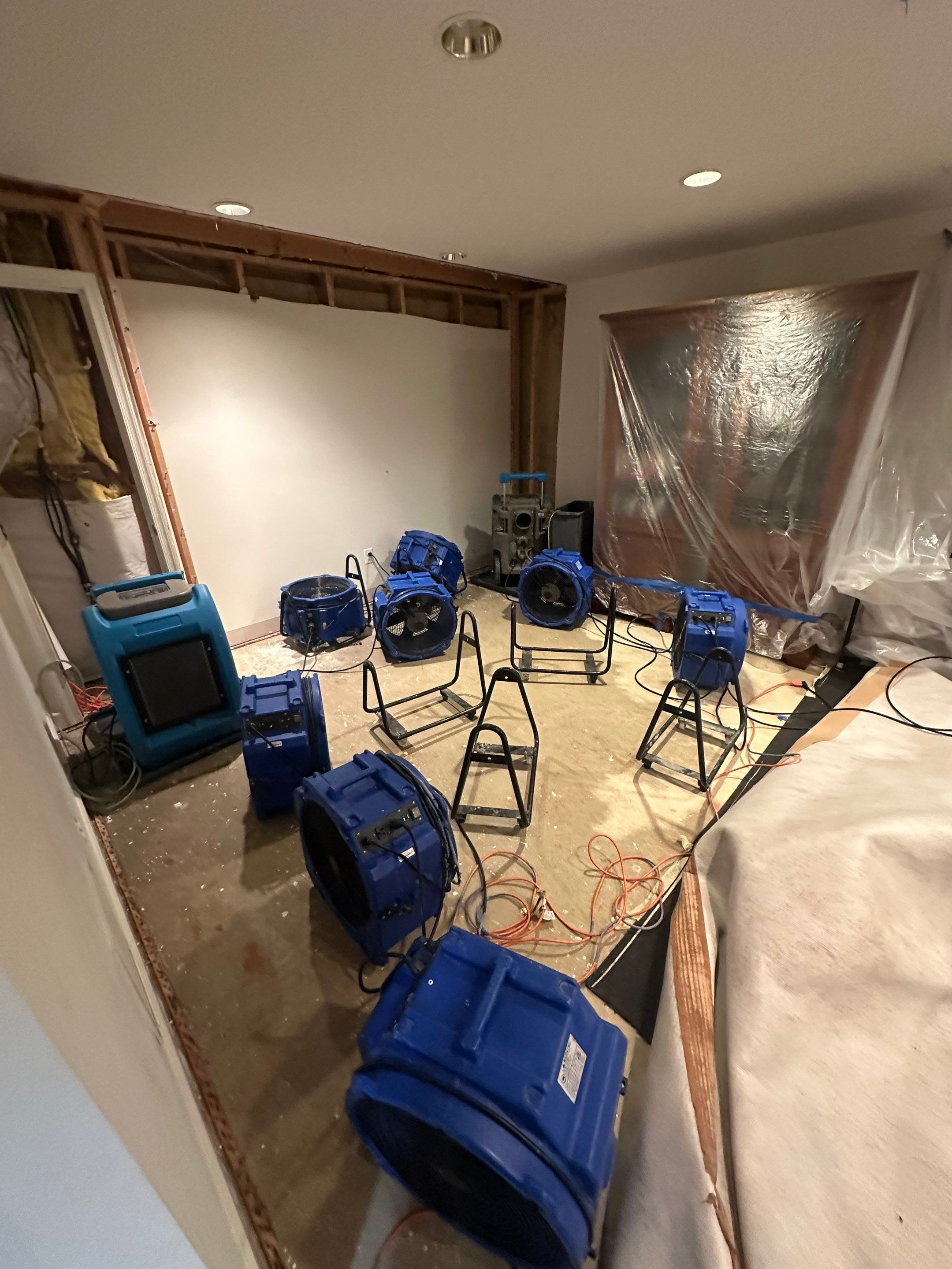 Ceiling damage assessment and preparation for repair work.