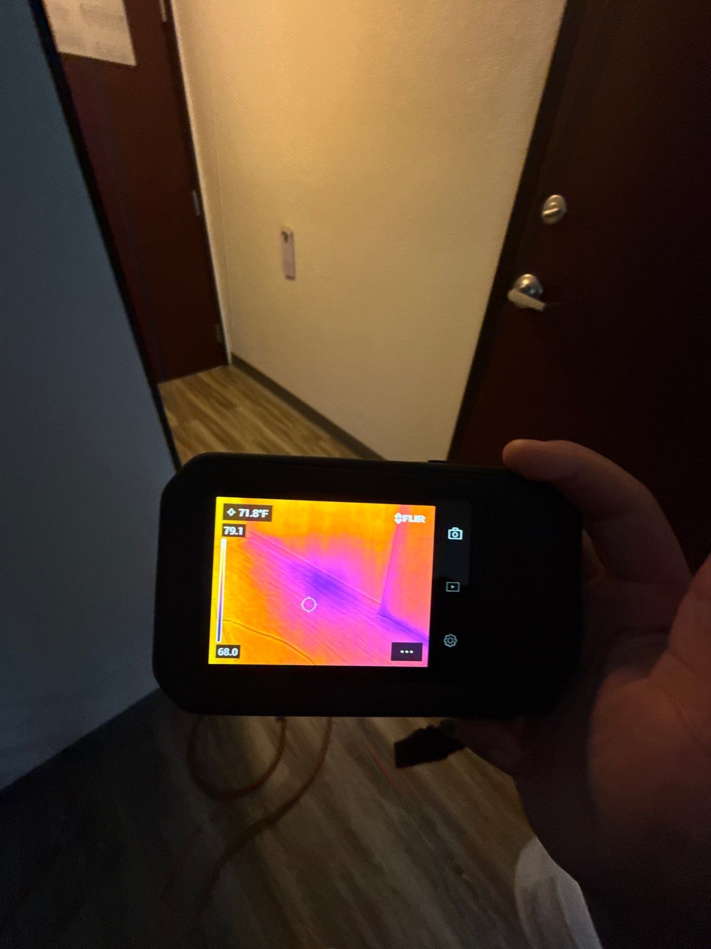 Thermal imaging camera capturing moisture distribution during water damage assessment in Manassas.
