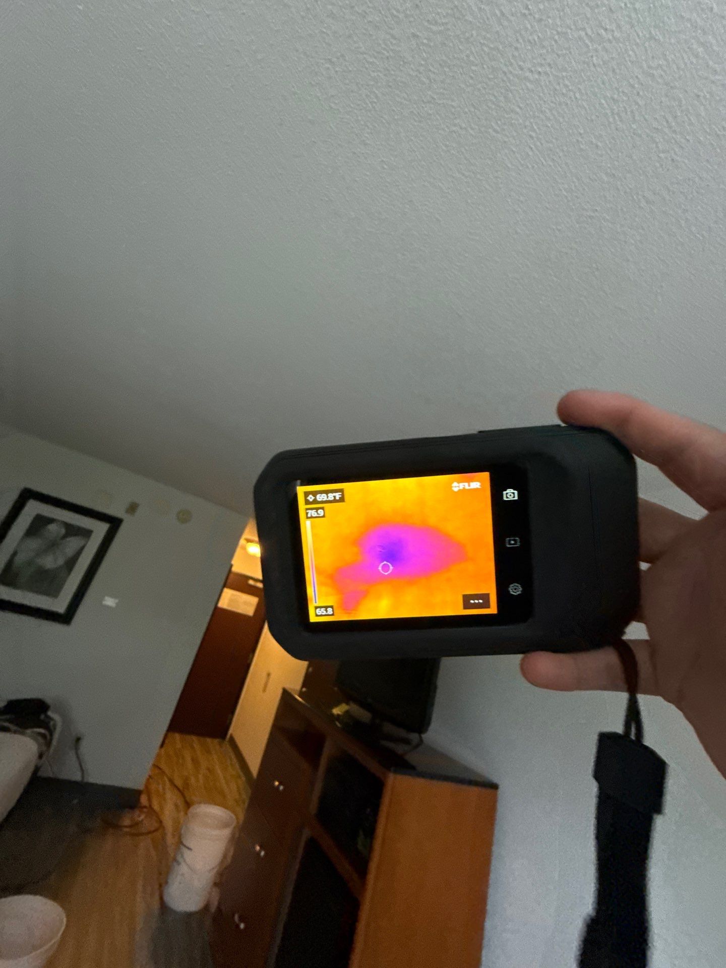 Infrared scan revealing hidden moisture patterns within wall cavity during restoration inspection.