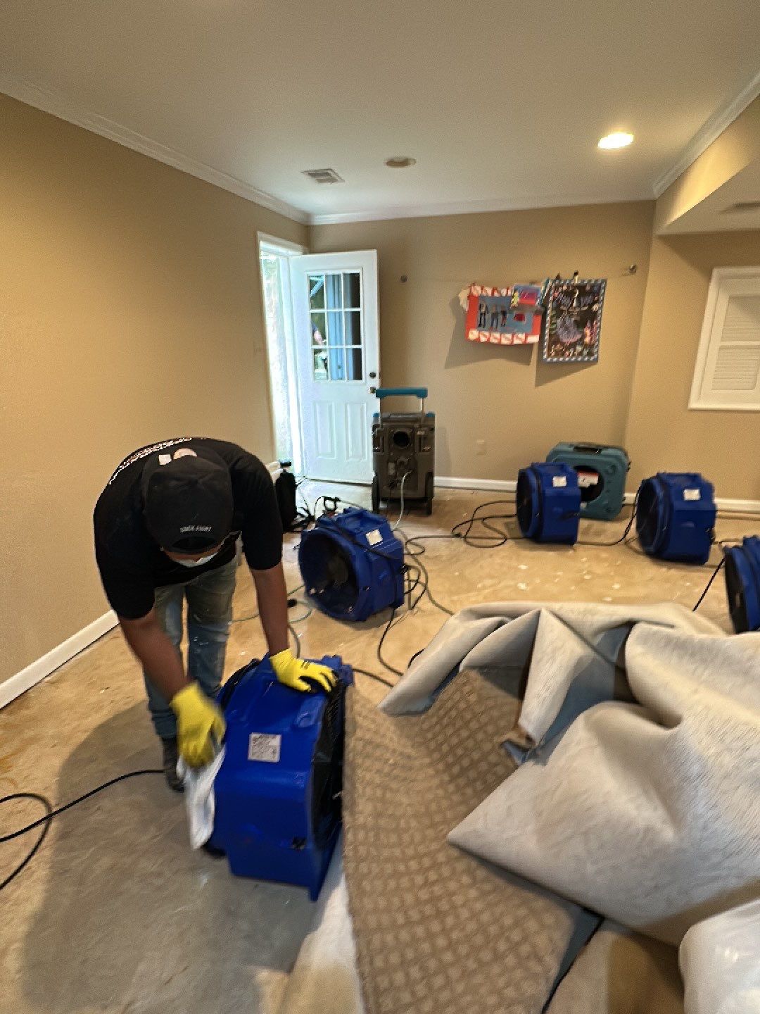 Dehumidification equipment positioned to extract moisture from structural materials during drying phase.