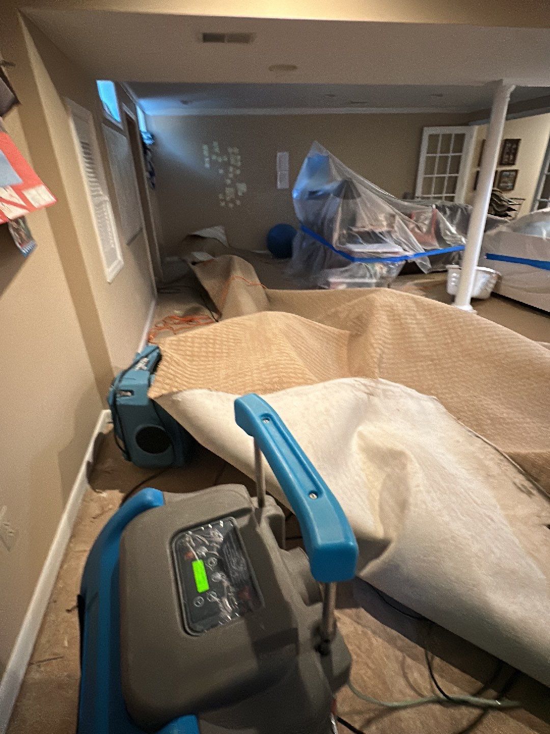 Structural drying in progress with targeted dehumidifier placement in Alexandria restoration.