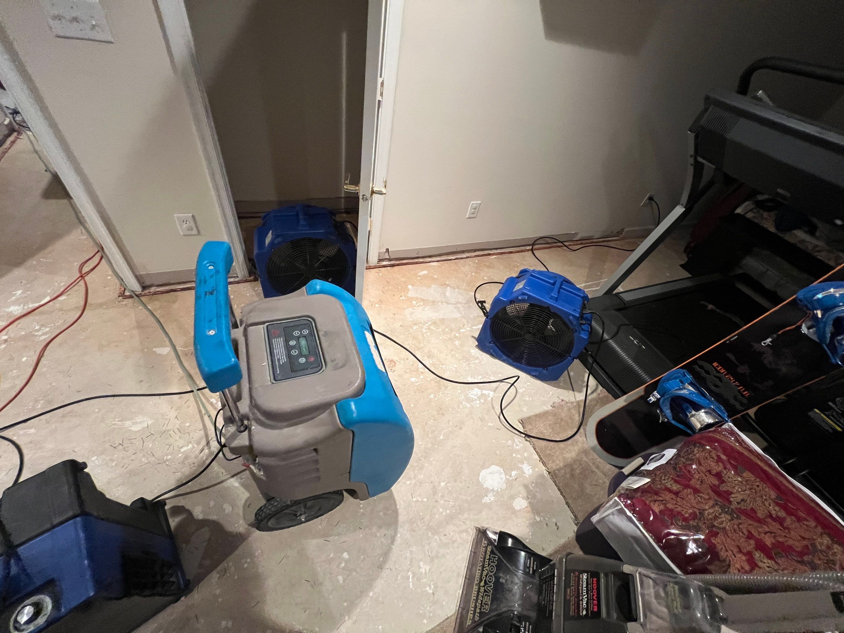 Dehumidification equipment positioned for structural drying phase of moisture remediation.